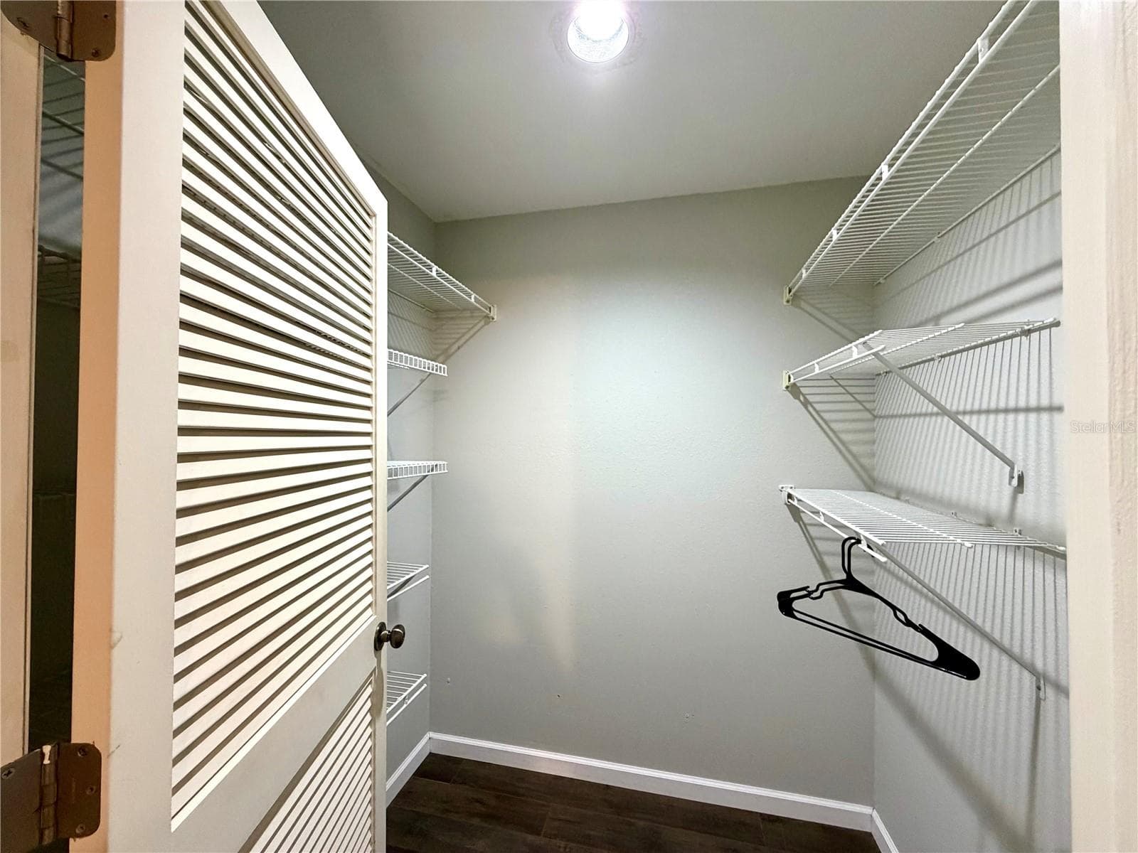 Walk-in closet in primary with plenty of shelving or room for additional storage furniture - 3606 57TH AVENUE DR W, BRADENTON