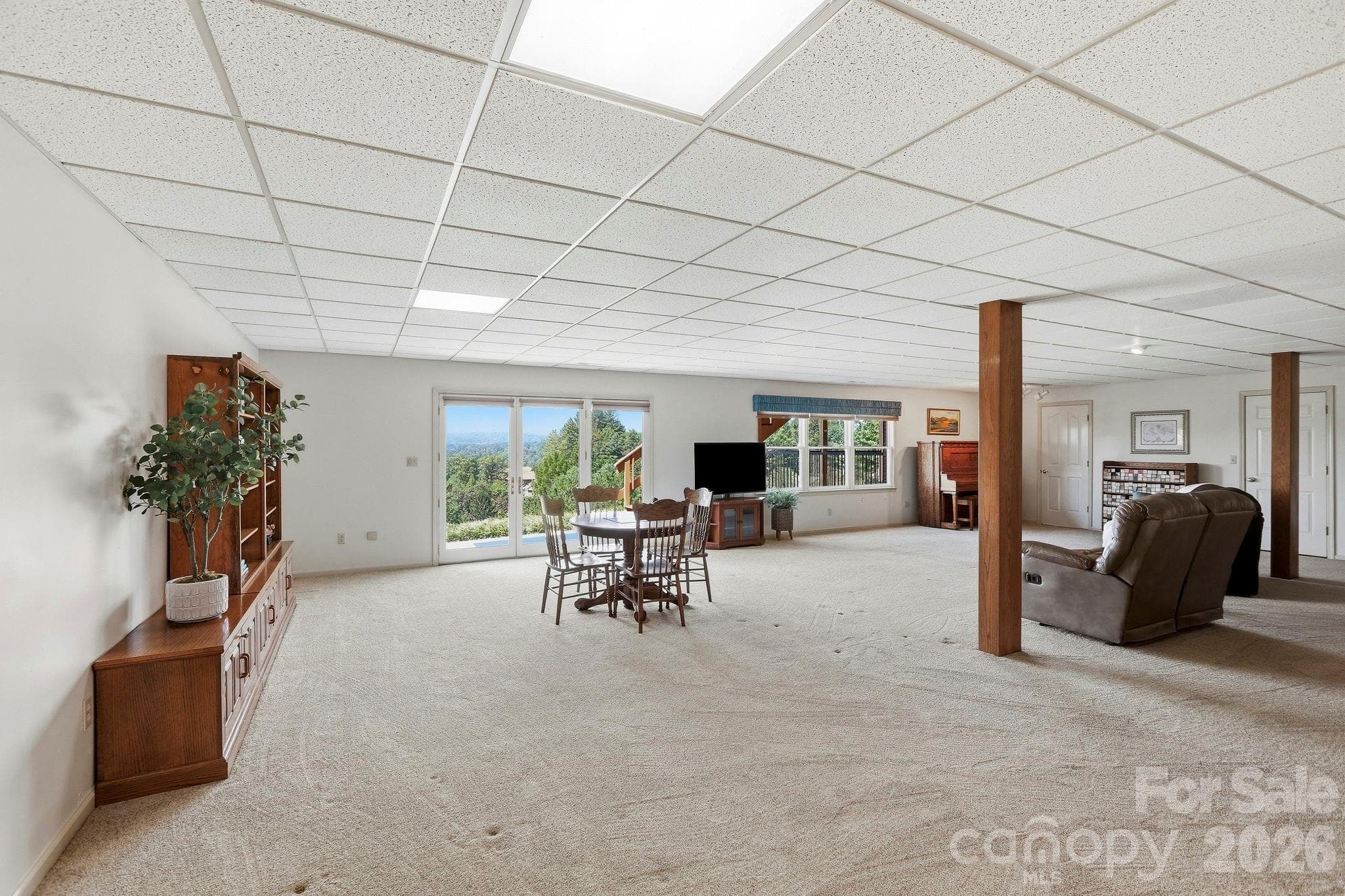Basement recreation room, the views continue from the lower level! - 244 Mountain Valley Drive, Hendersonville