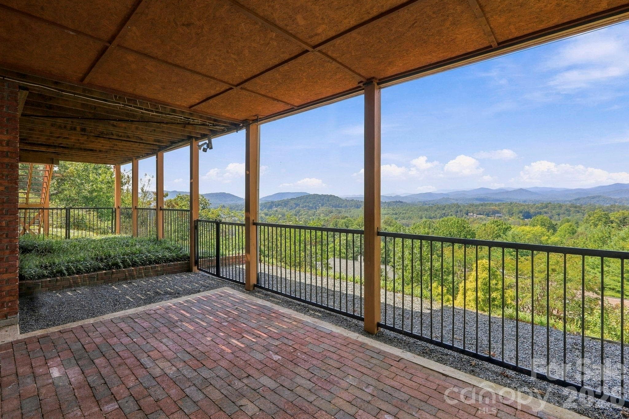 Small fenced area on the basement level - access to workshop and third garage - 244 Mountain Valley Drive, Hendersonville