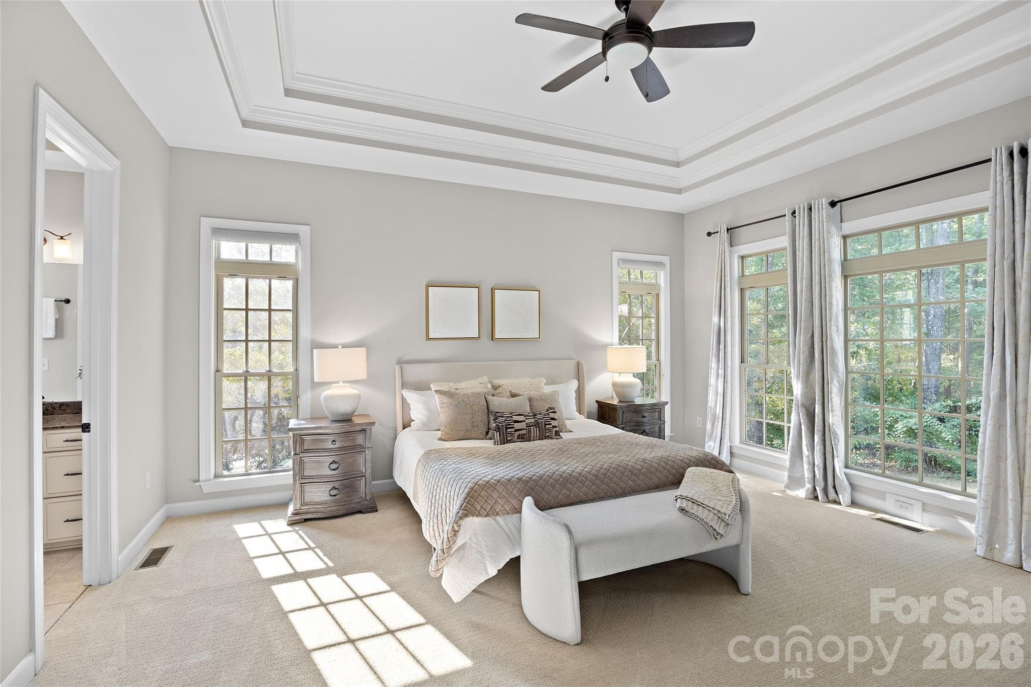 A spacious primary suite on the main level is a true oasis - 1623 Hawkstone Drive, Waxhaw
