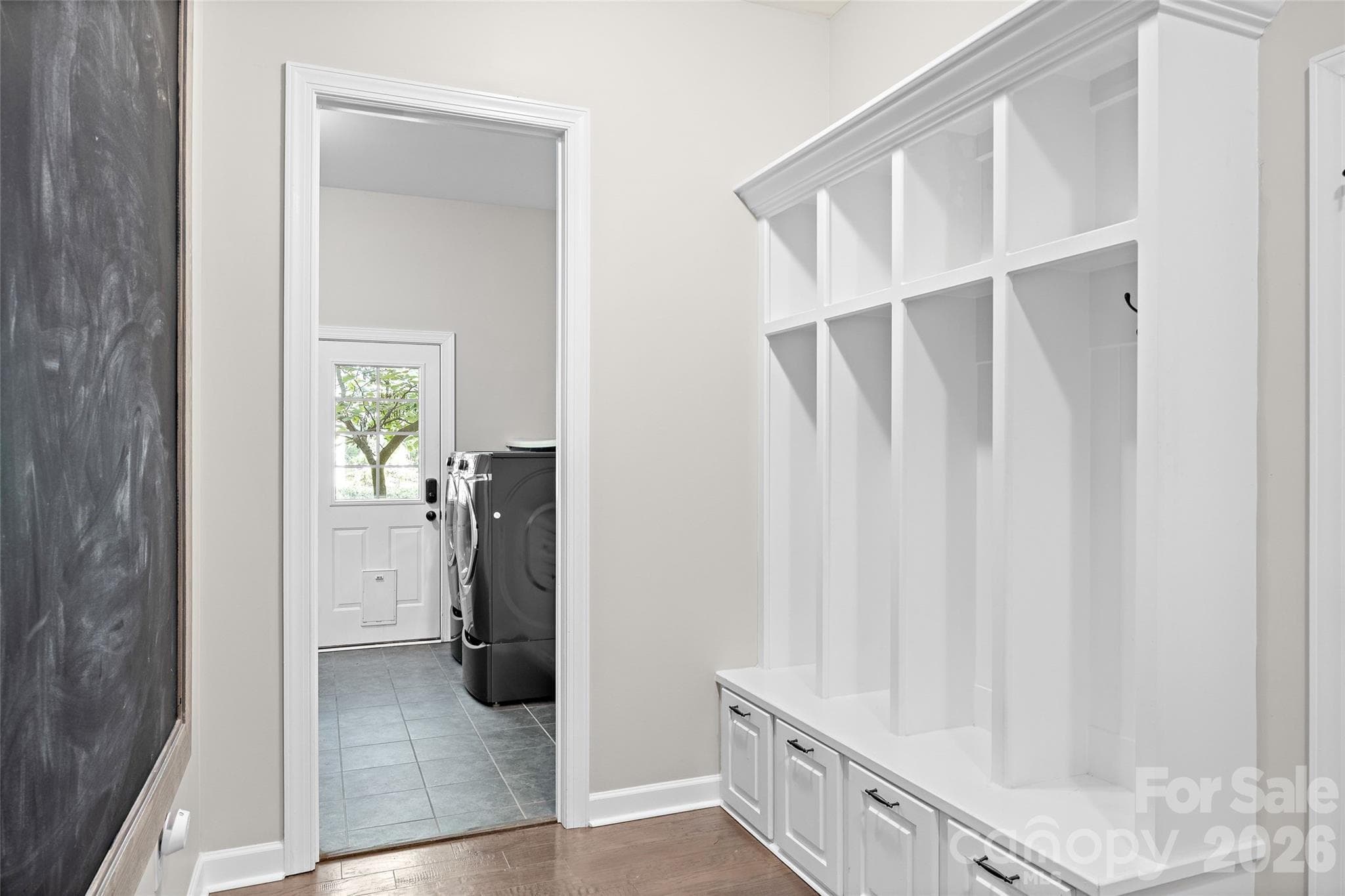 Drop zone area outside of the laundry room near the access to the 3-car garage. - 1623 Hawkstone Drive, Waxhaw