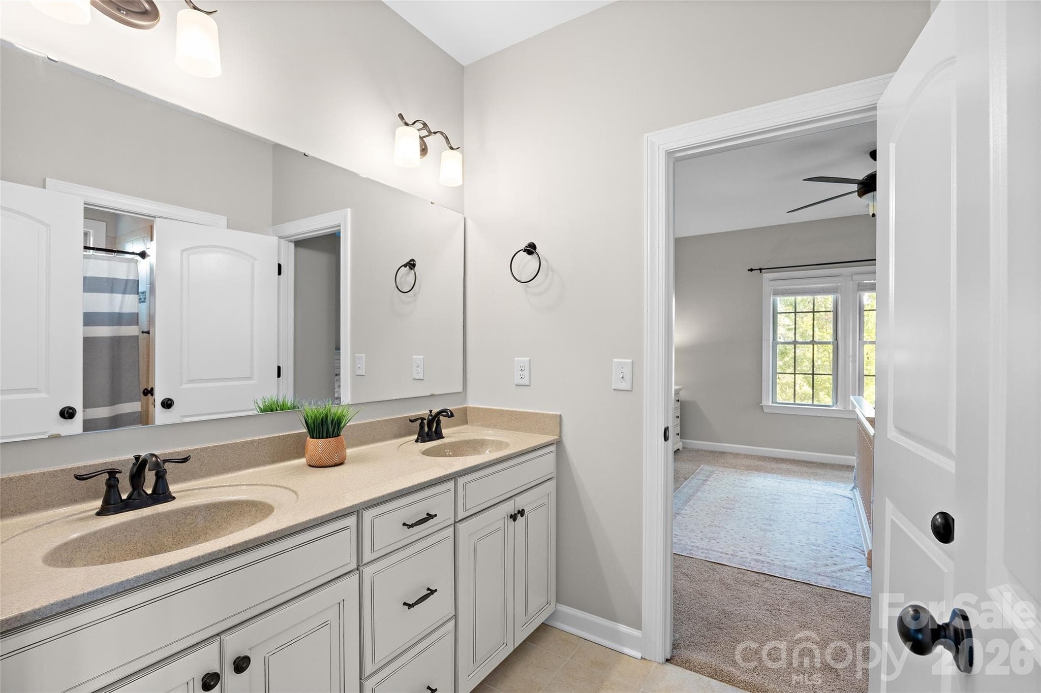 2nd full "Jack and Jill" bath features dual vanities and a shower/tub. - 1623 Hawkstone Drive, Waxhaw