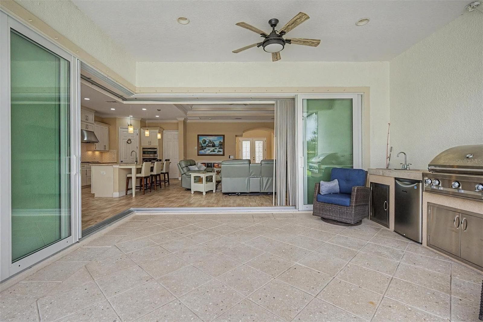 Oversized CORNER sliders lead to the outdoor kitchen and plenty of room for patio furniture - 4303 BARBOUR TRL, ODESSA