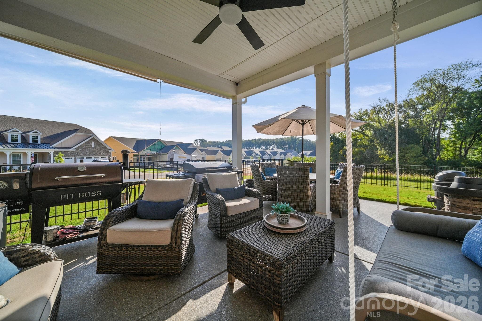 Back patio with ceiling fan and blinds on one side - 4007 Brush Creek, Monroe