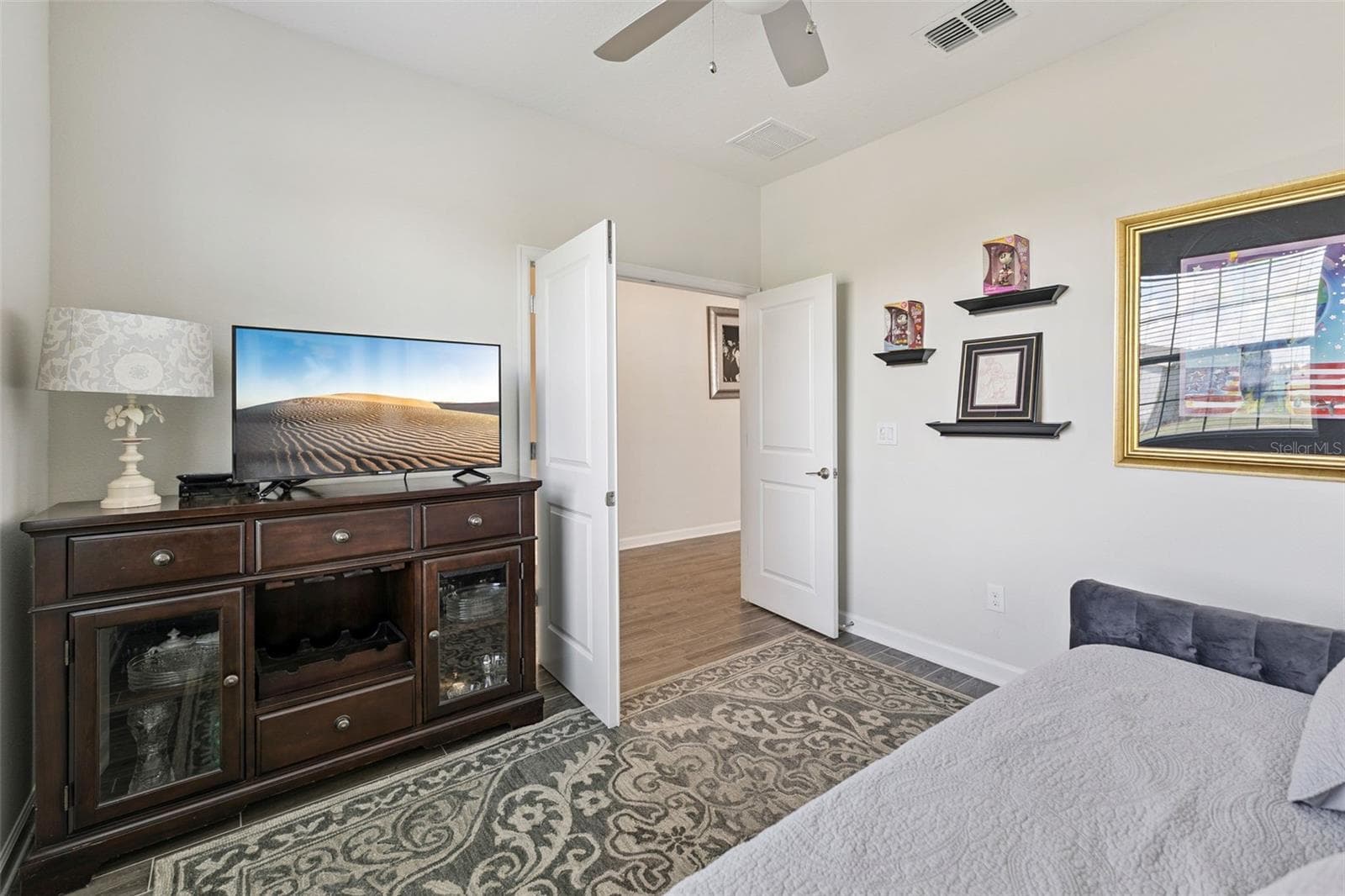 Den features French Doors and Ceiling Fan - 4075 BEDFORD AVE, WINTER HAVEN