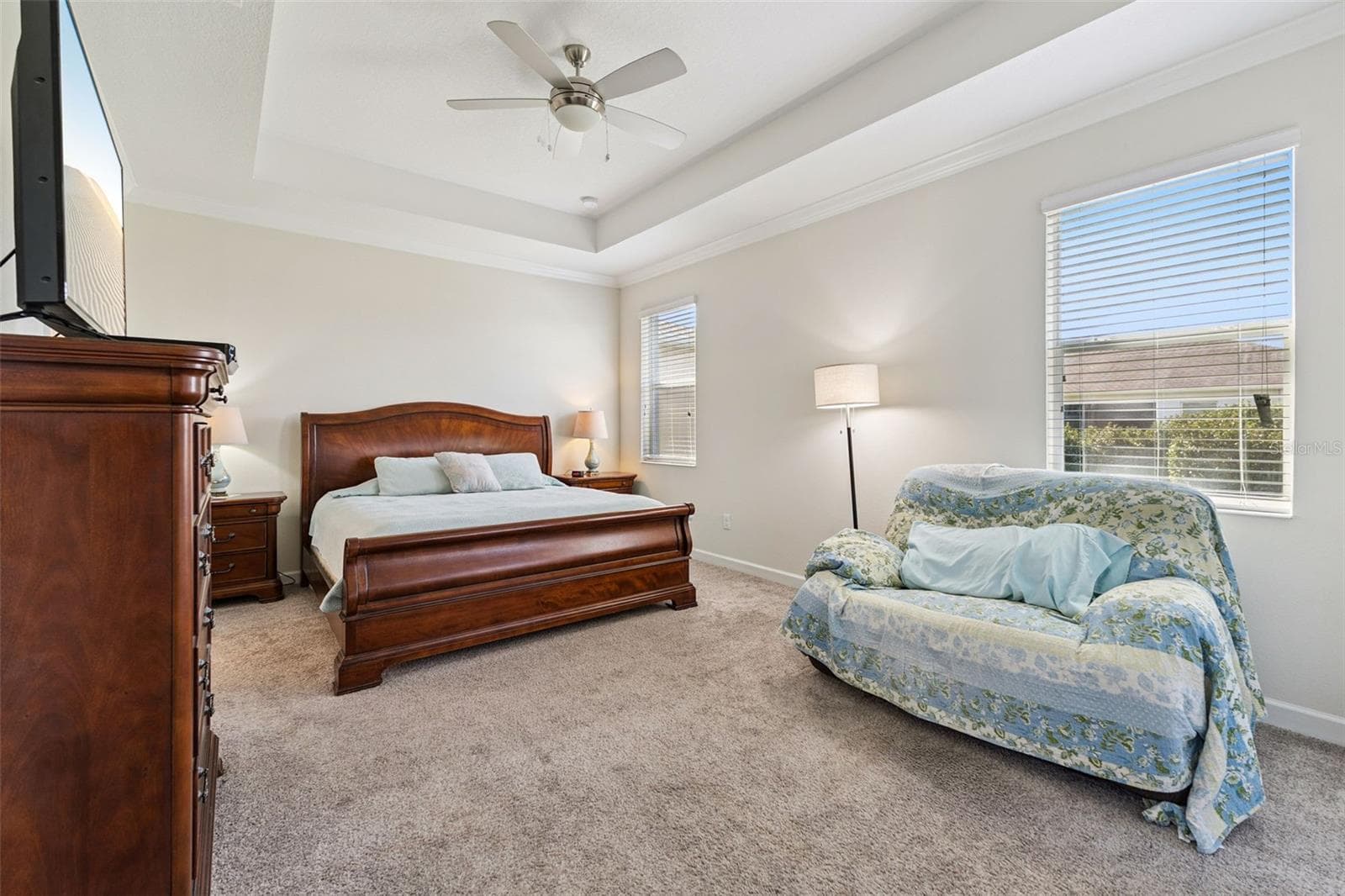 The Primary Bedroom Suite offers a peaceful retreat, featuring a tray ceiling - 4075 BEDFORD AVE, WINTER HAVEN