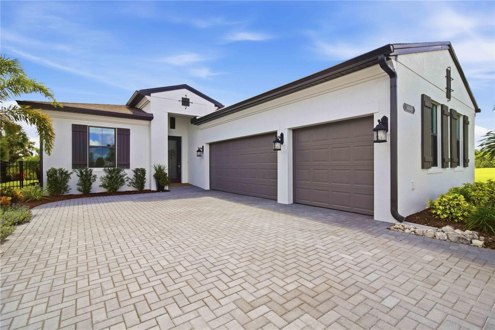 Stylish Exterior Spanish Elevation - 14449 HAMMOCK OAK ST, PARRISH