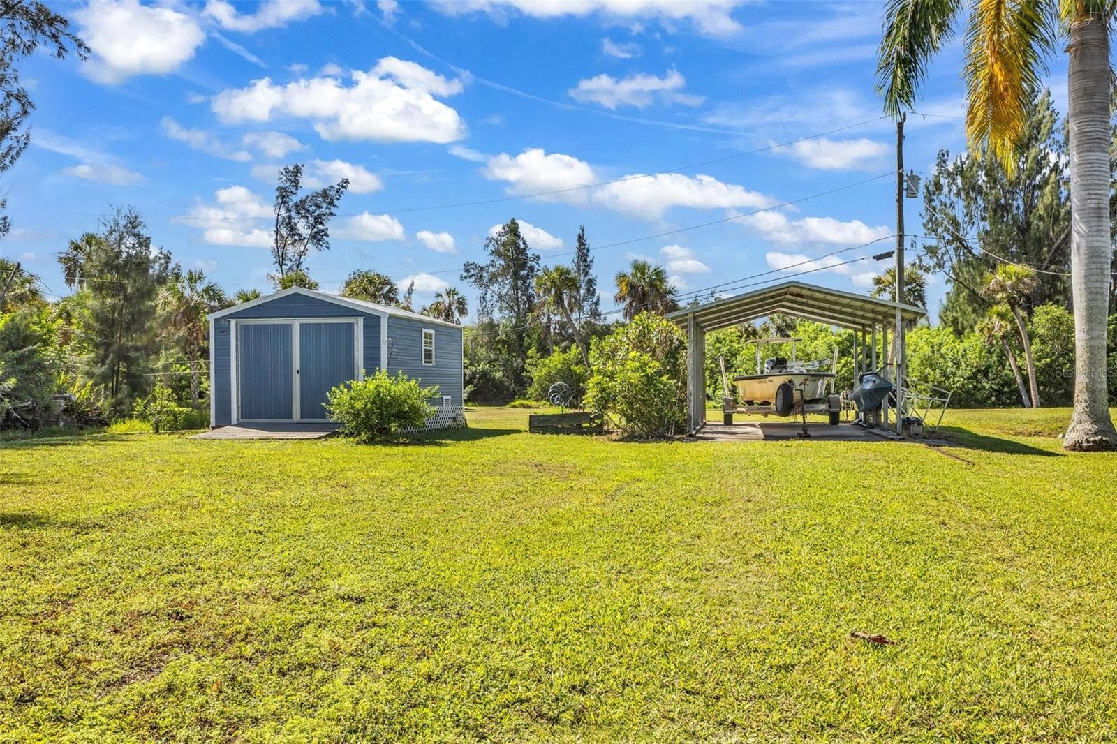 Shed and carport in side lot - 3407 ISLAND VIEW DR, PUNTA GORDA