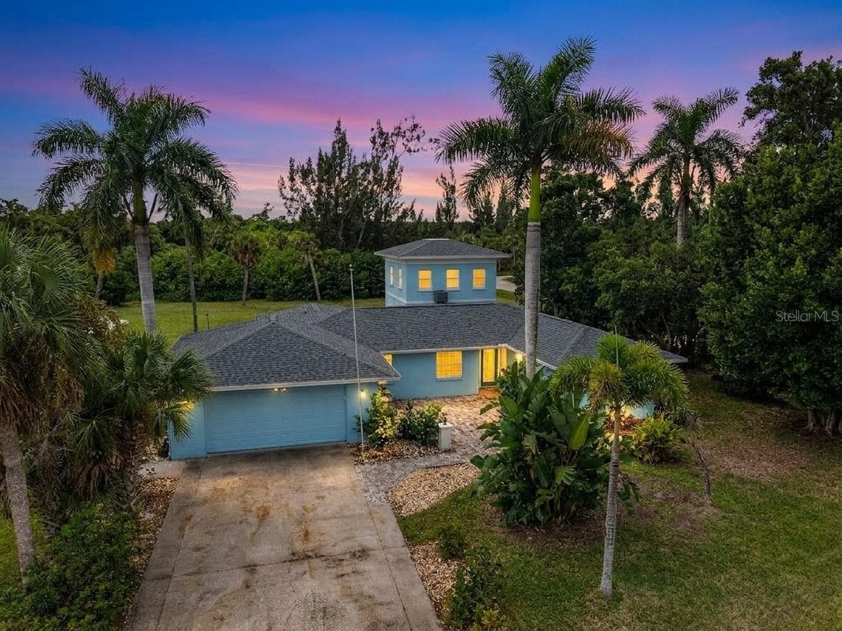 Front of home at sunset - 3407 ISLAND VIEW DR, PUNTA GORDA