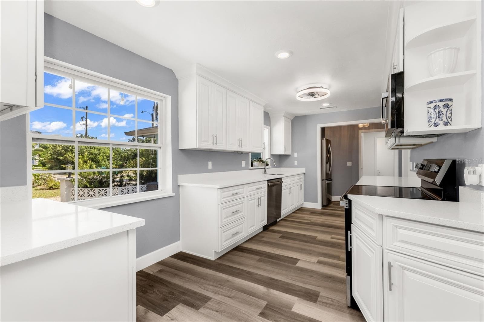 Kitchen with large window and window above sink - 3407 ISLAND VIEW DR, PUNTA GORDA