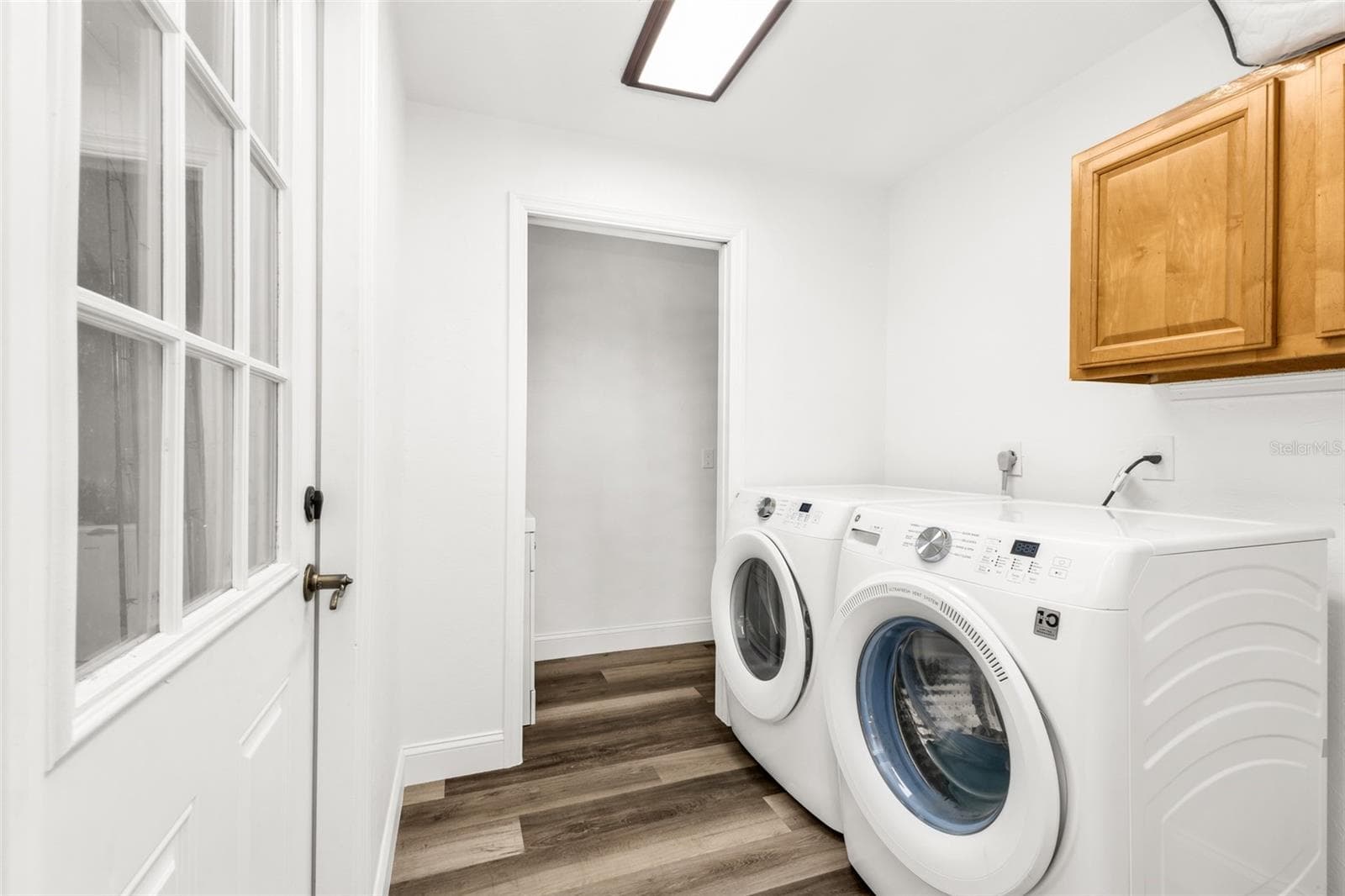 Laundry Room with access to garage and half bath - 3407 ISLAND VIEW DR, PUNTA GORDA