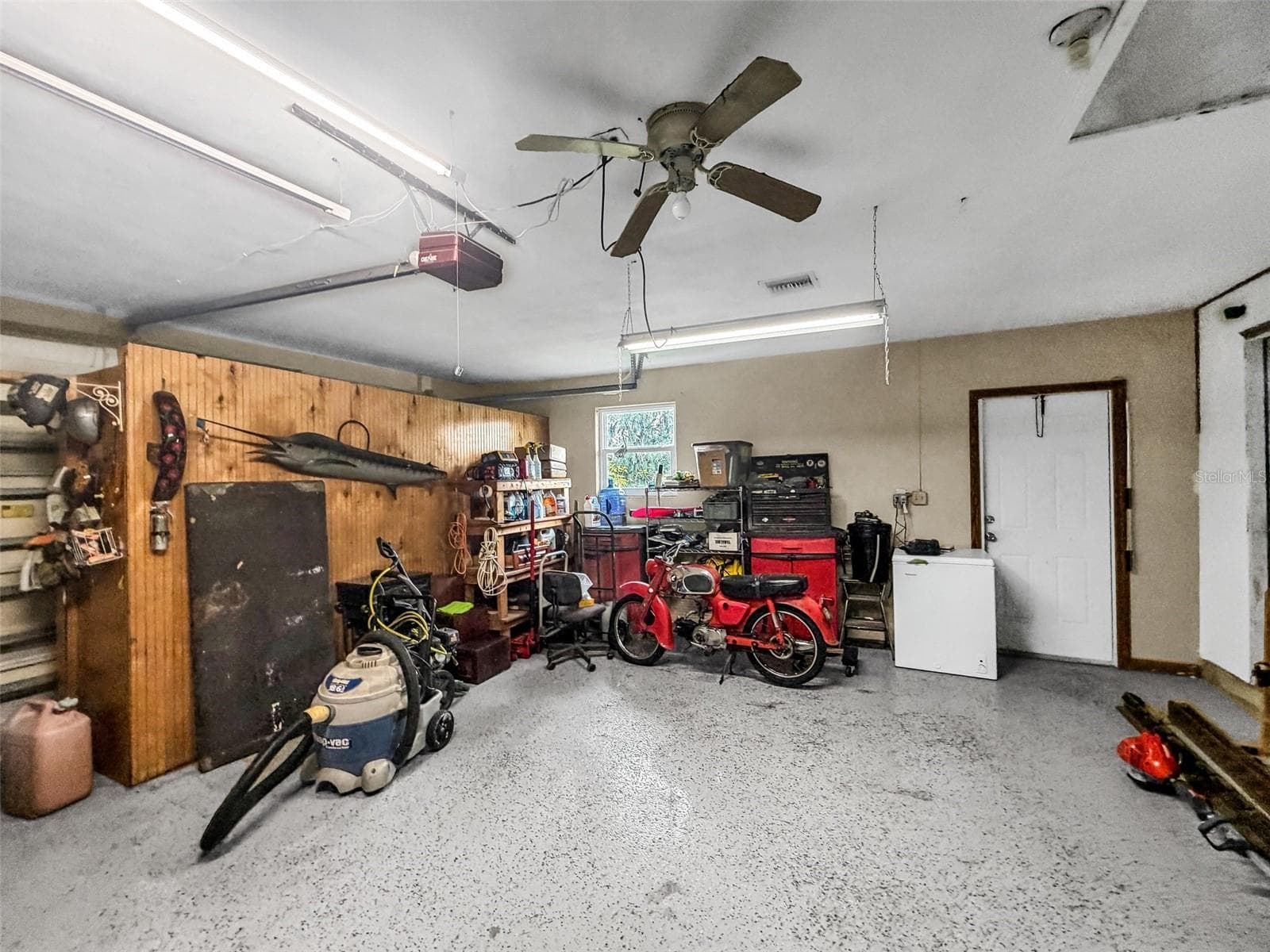 2 Car garage with additional storage room - 3407 ISLAND VIEW DR, PUNTA GORDA