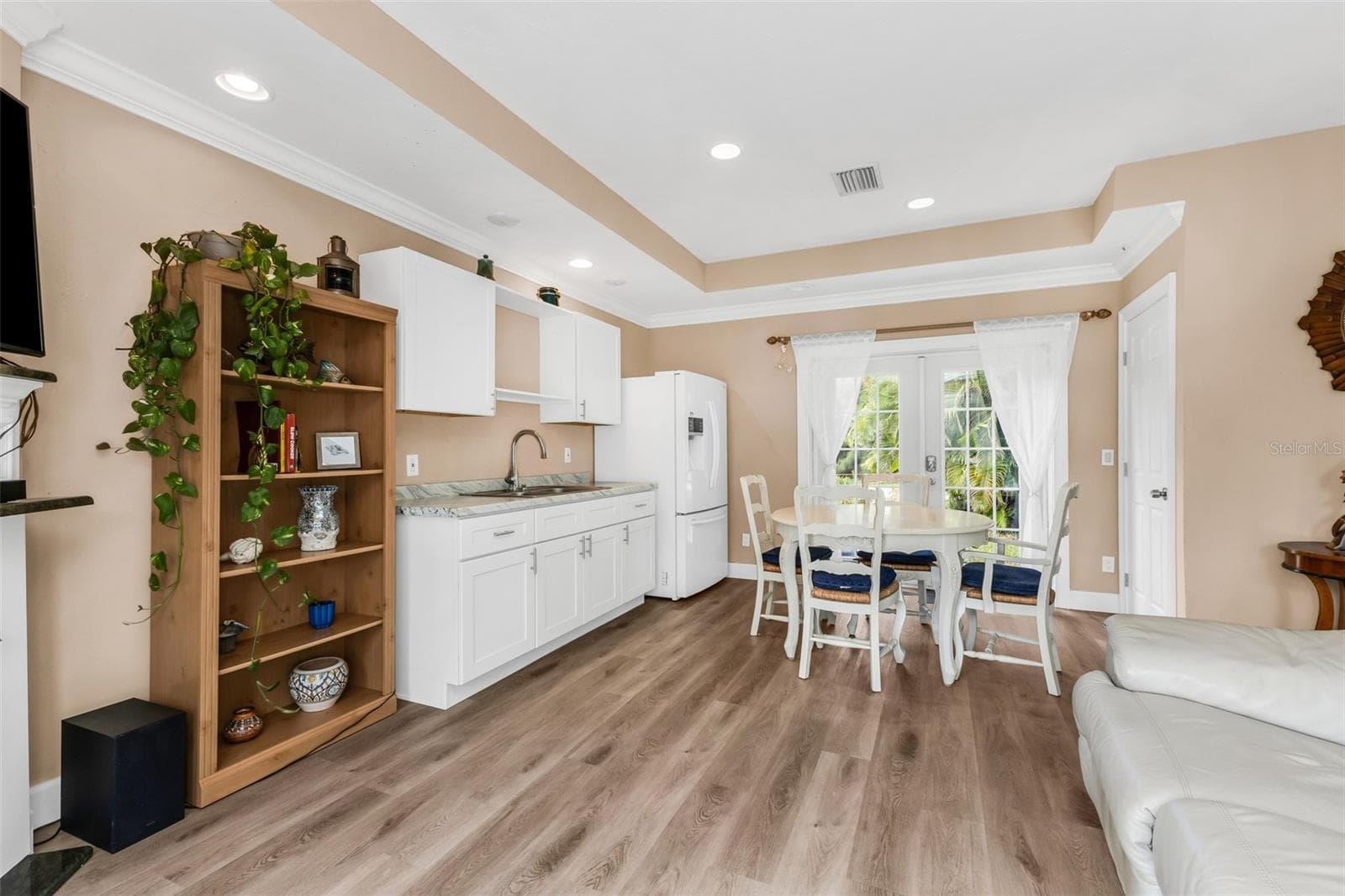 View of Kitchen, Living and Front entry. Large walk-in closet for added storage - 3407 ISLAND VIEW DR, PUNTA GORDA