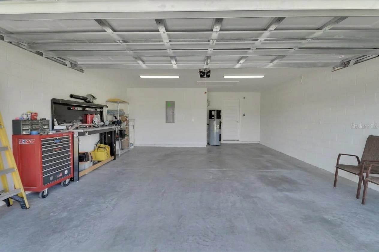 2 car garage with workbench area and extra storage - 1022 MEGANO BLVD, DELAND