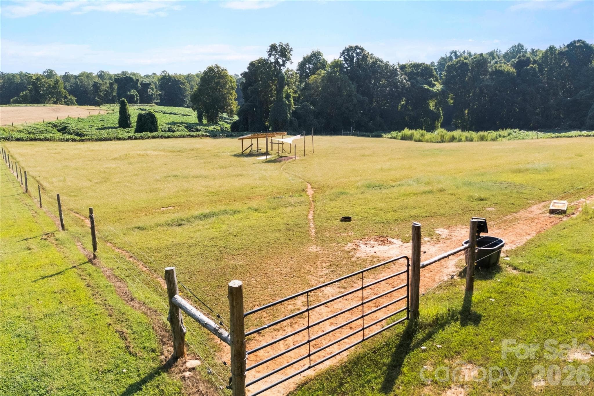 Fenced pasture at back of property with animal shelter - 2665 Umberger Road, Cleveland