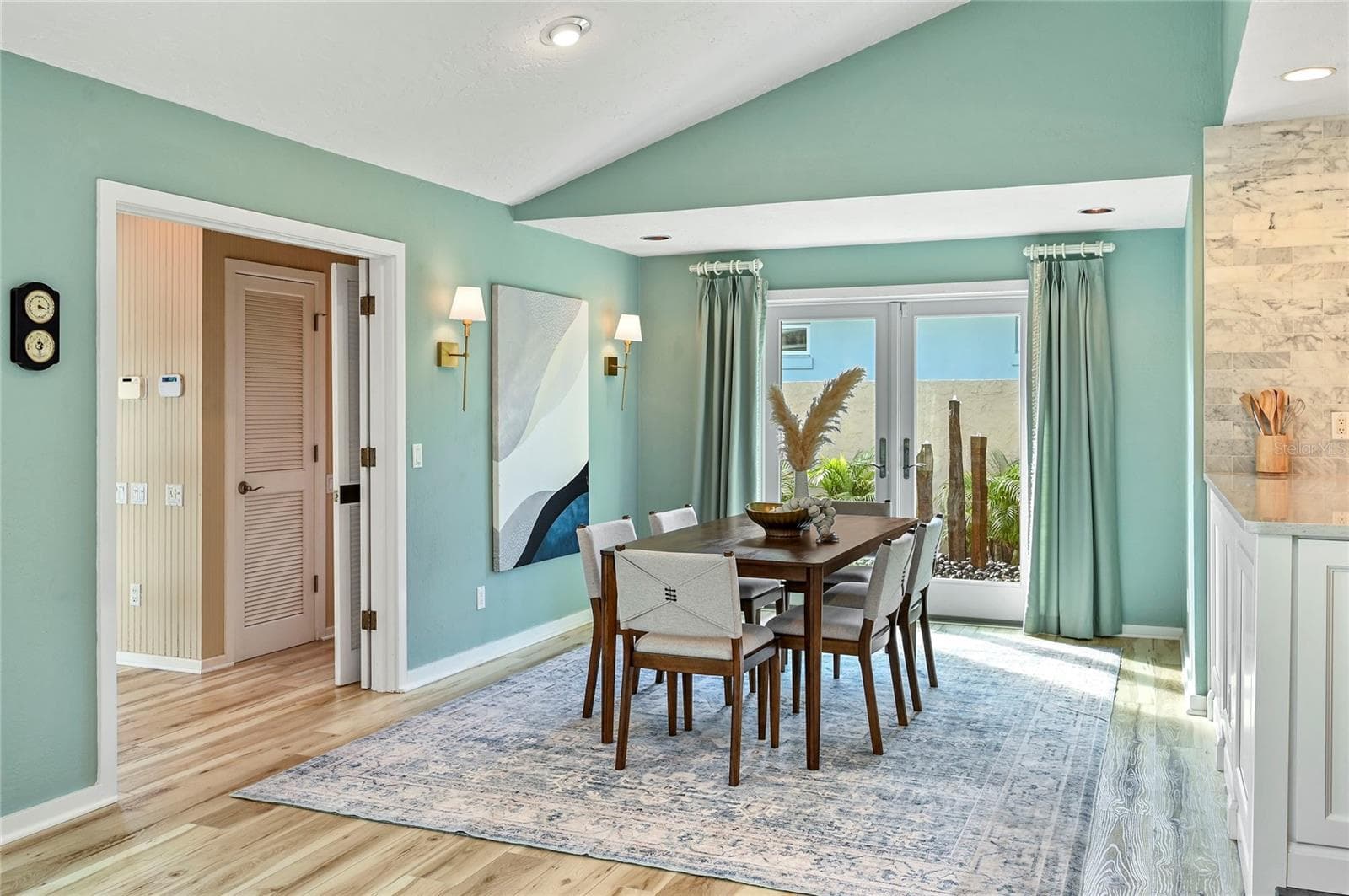 Dining Room Opens to Private Courtyard and Fountain - 1215 COMMODORE DR, NEW SMYRNA BEACH