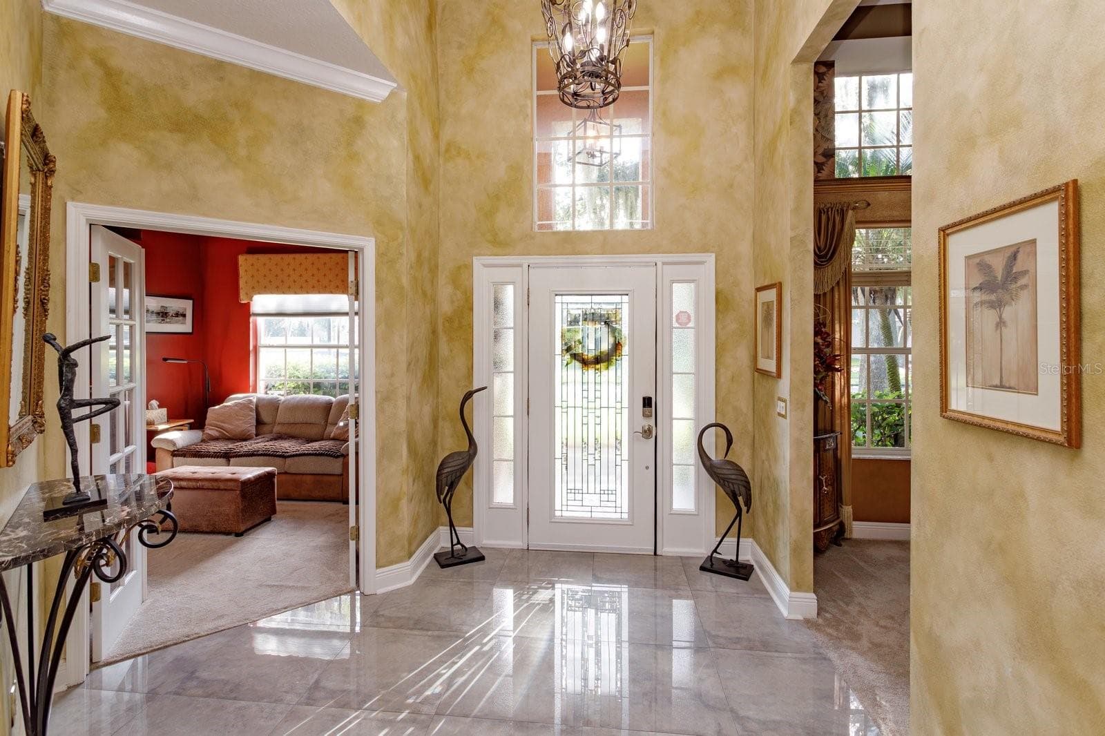 Foyer with bdrm 2 on left and dining room on right - 536 AVON GLADE PL, SANFORD