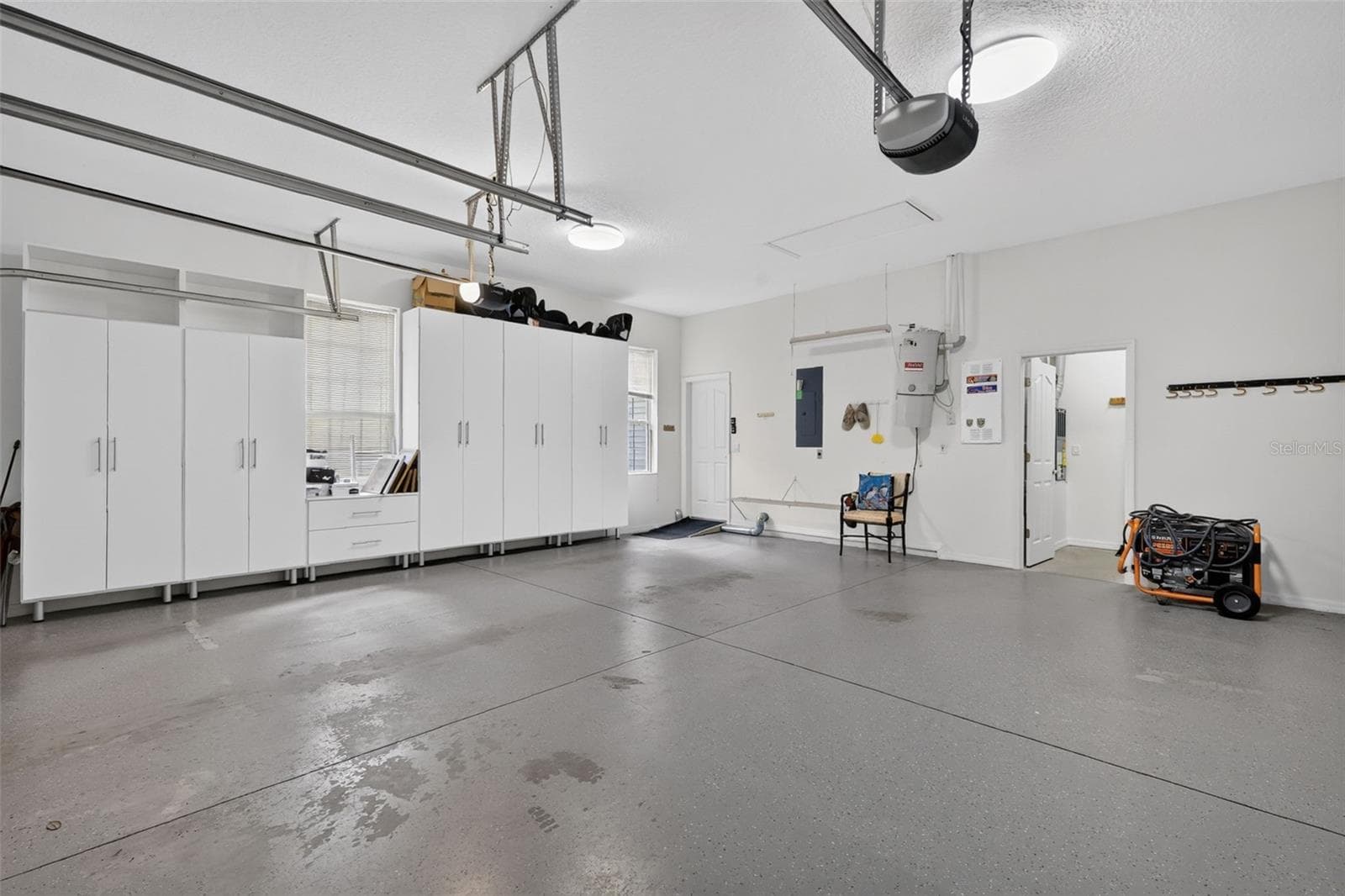 Garage has storage cabinets and an extra storage room - 35015 RADIO RD, LEESBURG