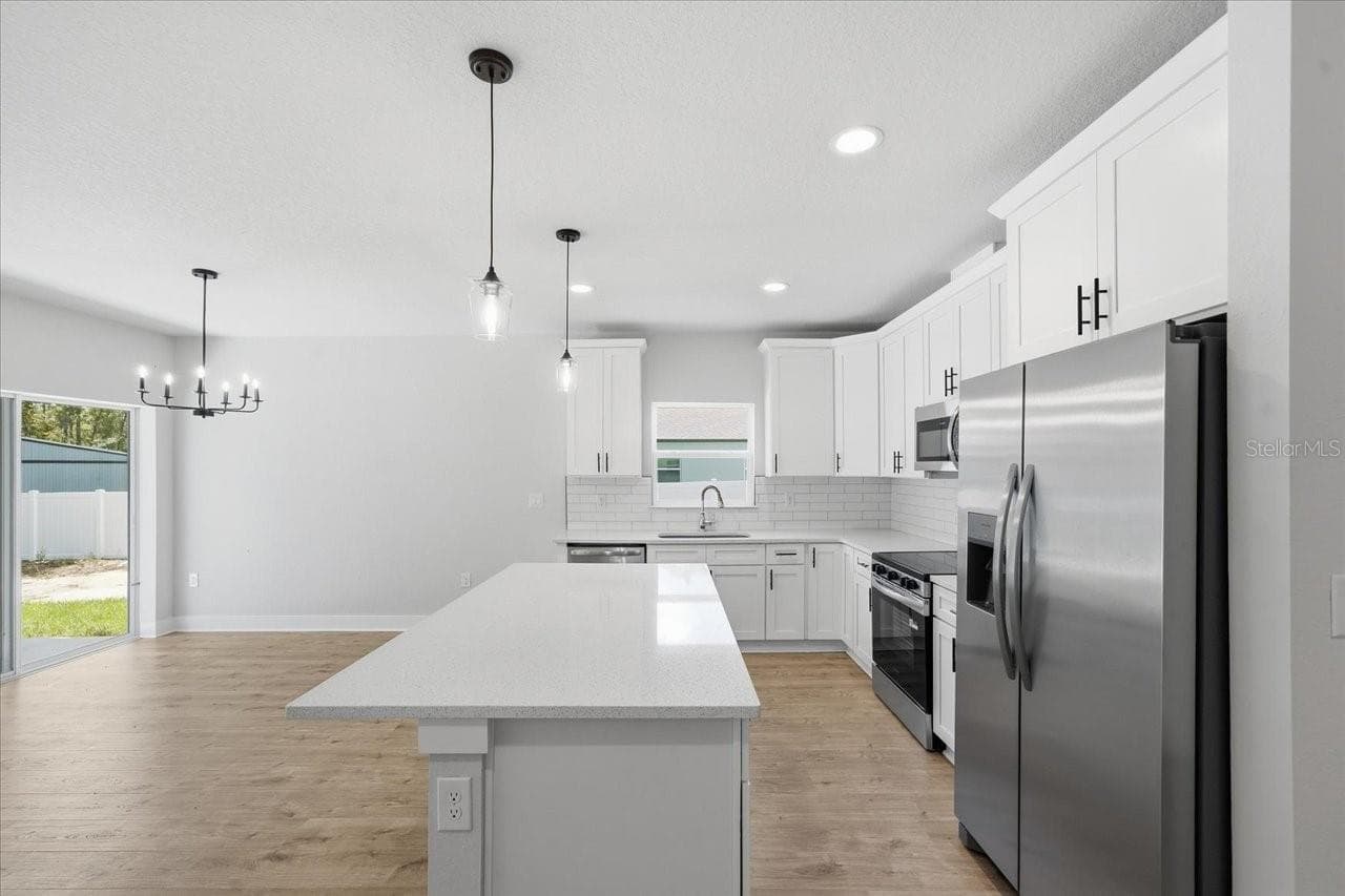 Single Family Residence at 13014 DOWNY WOODPECKER RD, WEEKI WACHEE, photo 6 of 27