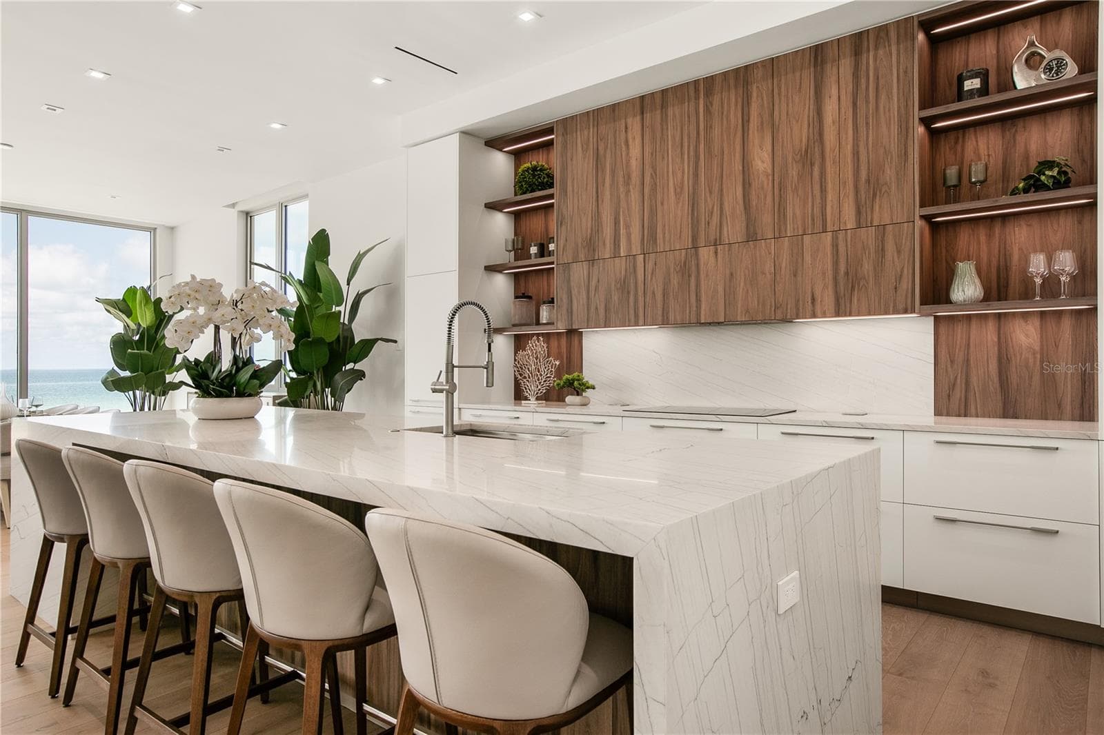 The oversized Quartzite waterfall island seats 5. - 6489 GULFSIDE RD, LONGBOAT KEY