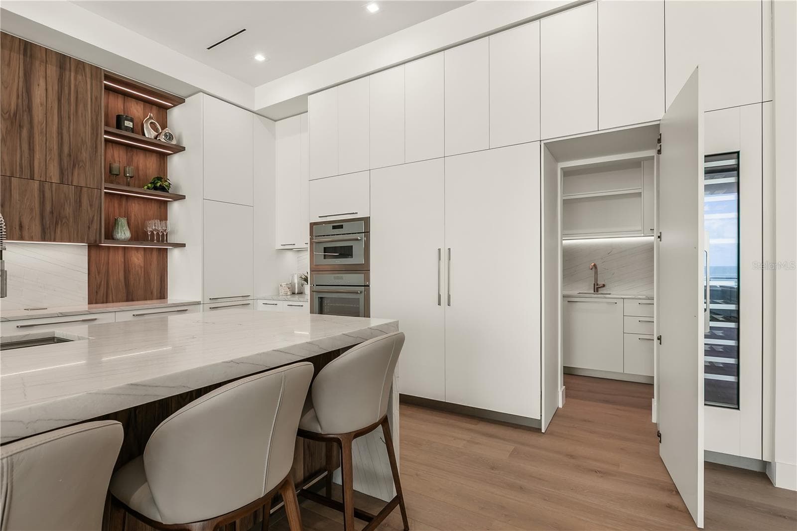Kitchen hosts a hidden scullery - 6489 GULFSIDE RD, LONGBOAT KEY