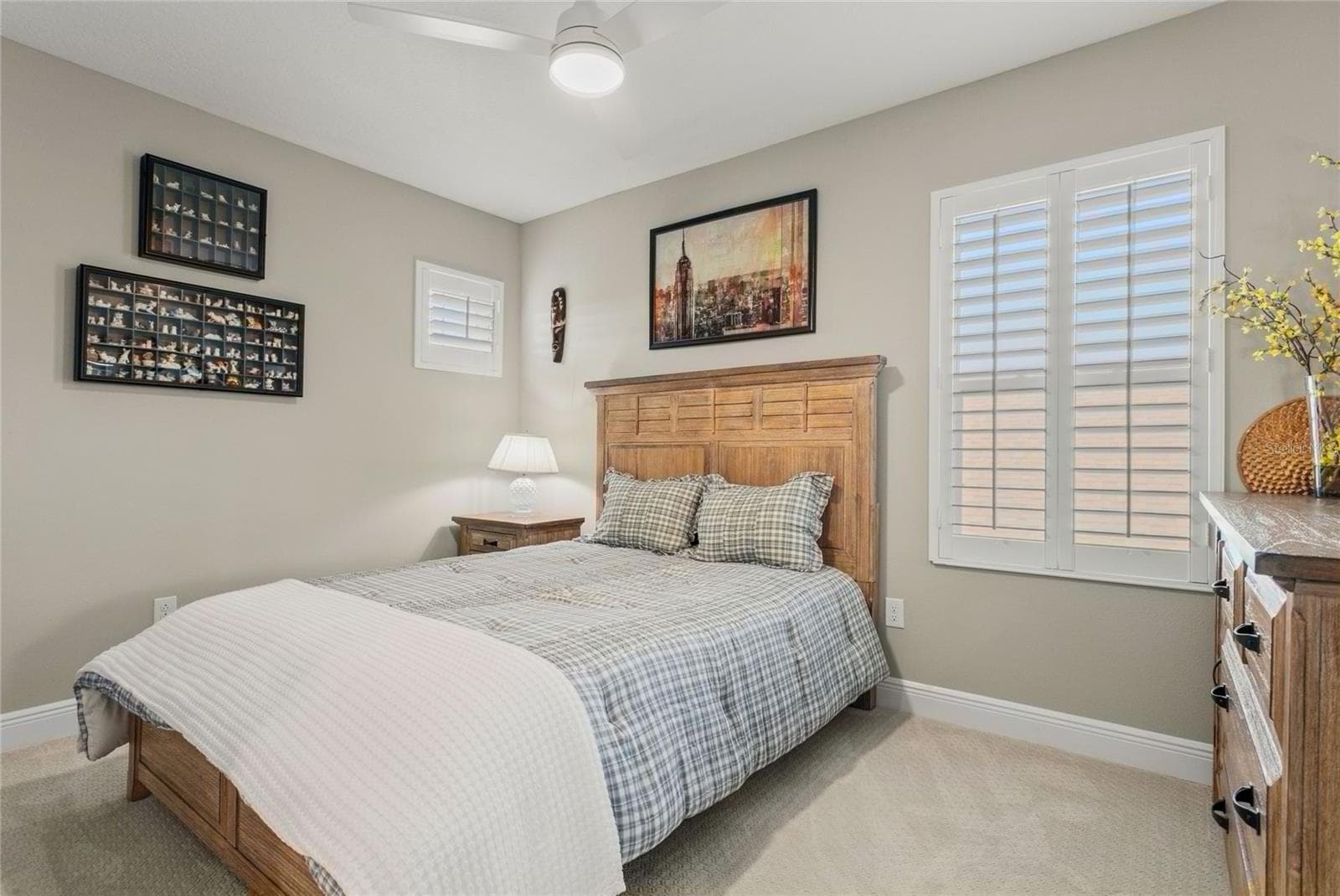 Upstairs bonus room with closet, neutral finishes, natural light, and a versatile layout ideal for guests, hobbies, or additional living space - 10625 FALLING LEAF CT, PARRISH