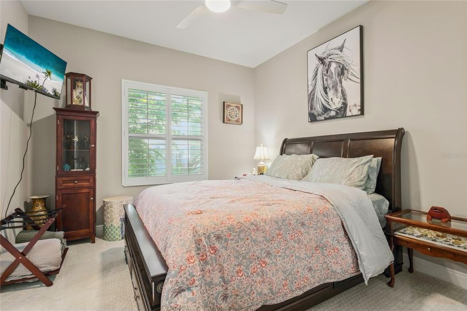 Downstairs en-suite bedroom with private bathroom, neutral finishes, and convenient front-of-home location ideal for guests or multi-generational living. - 10625 FALLING LEAF CT, PARRISH