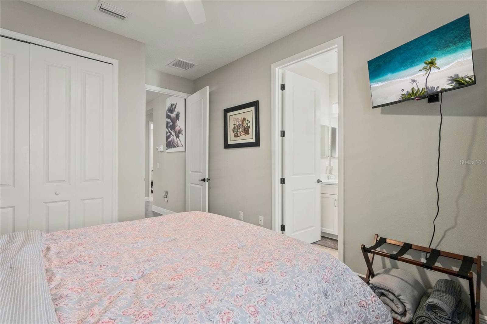 Downstairs private en-suite bathroom with modern finishes, convenient front-of-home location, and ideal privacy for guests or multi-generational living. - 10625 FALLING LEAF CT, PARRISH