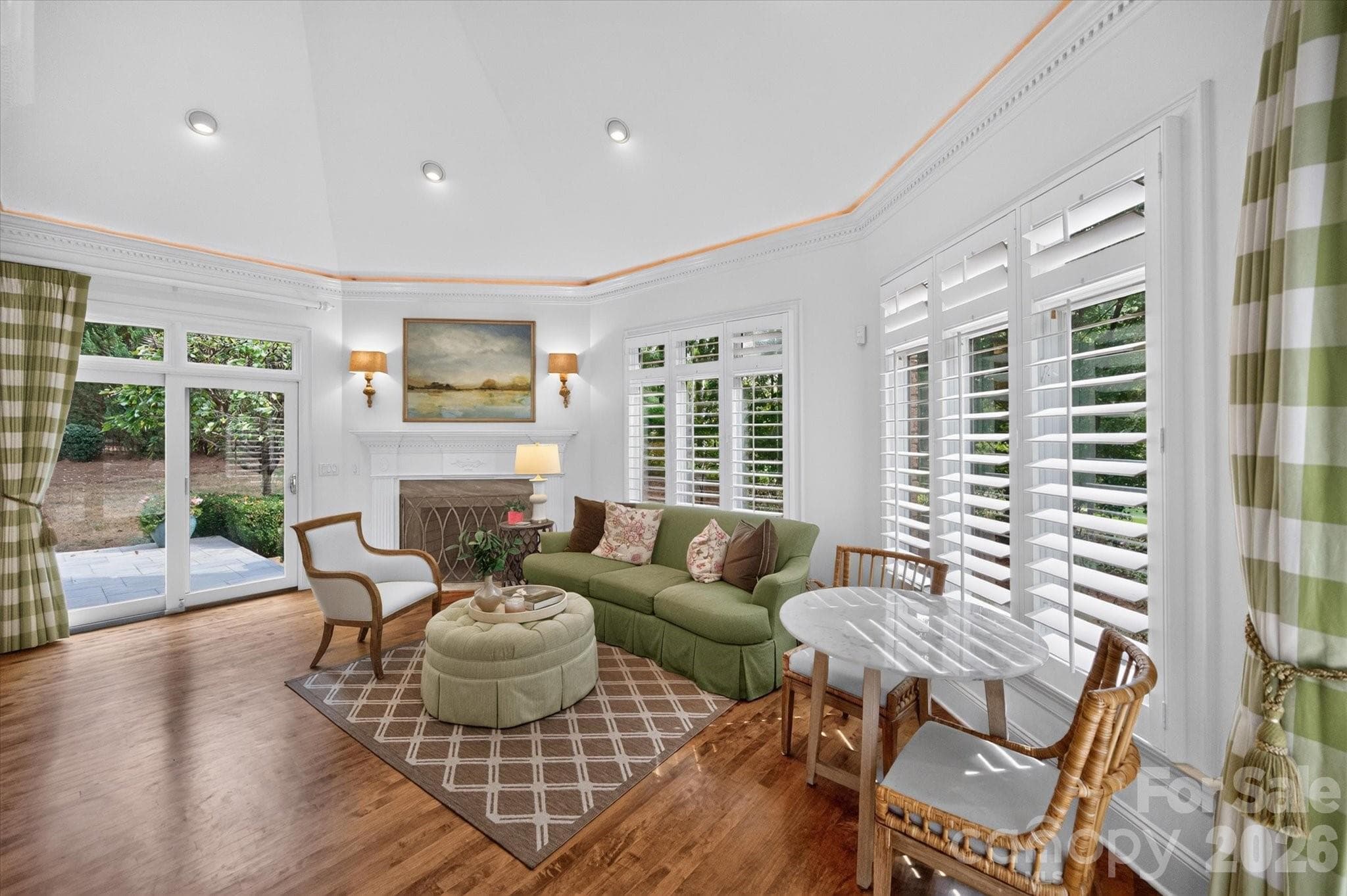 Keeping room with fireplace off kitchen leads to covered porch - 1005 Firethorne Club Drive, Marvin