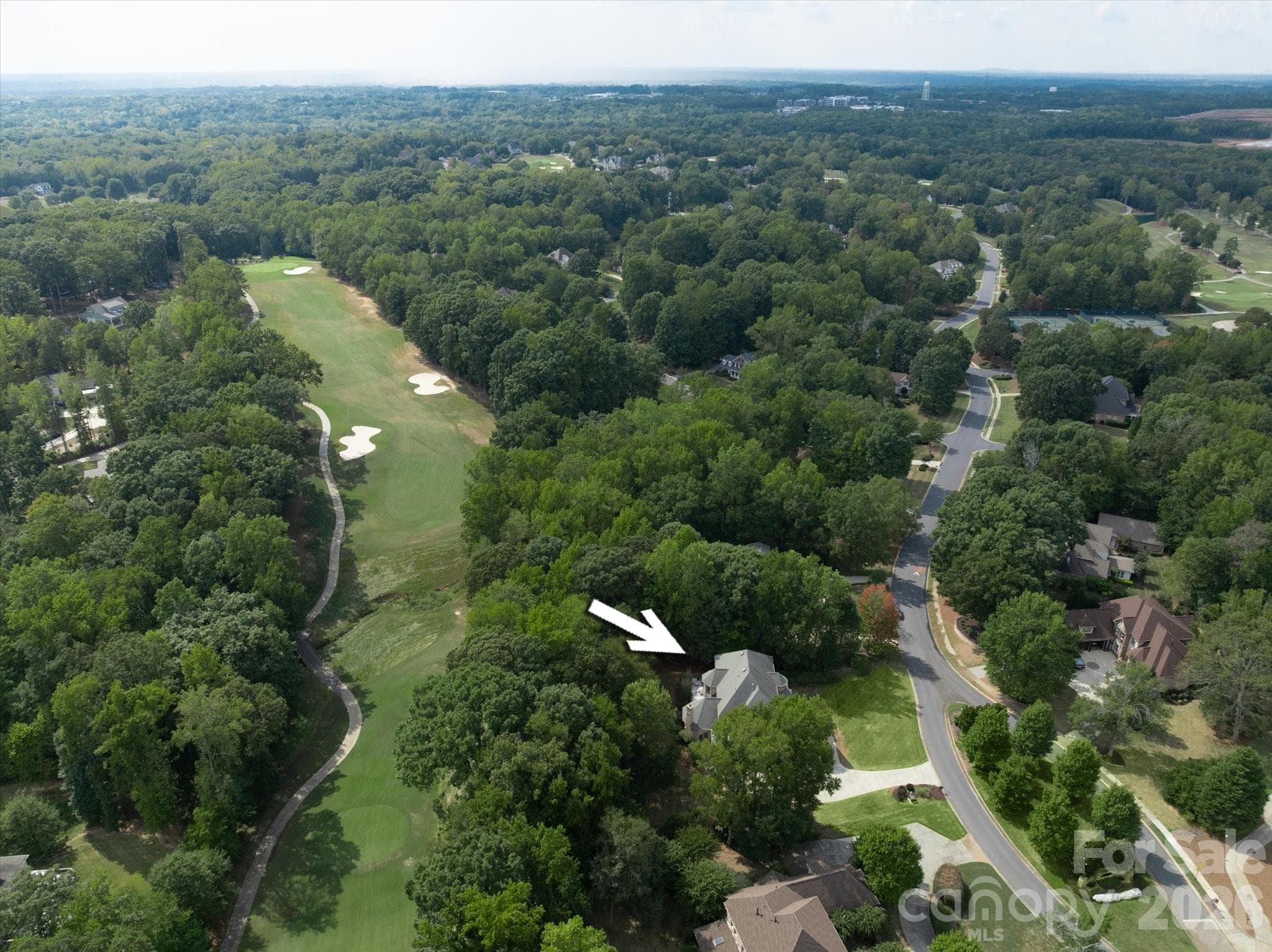 Course position near the tee boxes and close to the clubhouse - 1005 Firethorne Club Drive, Marvin