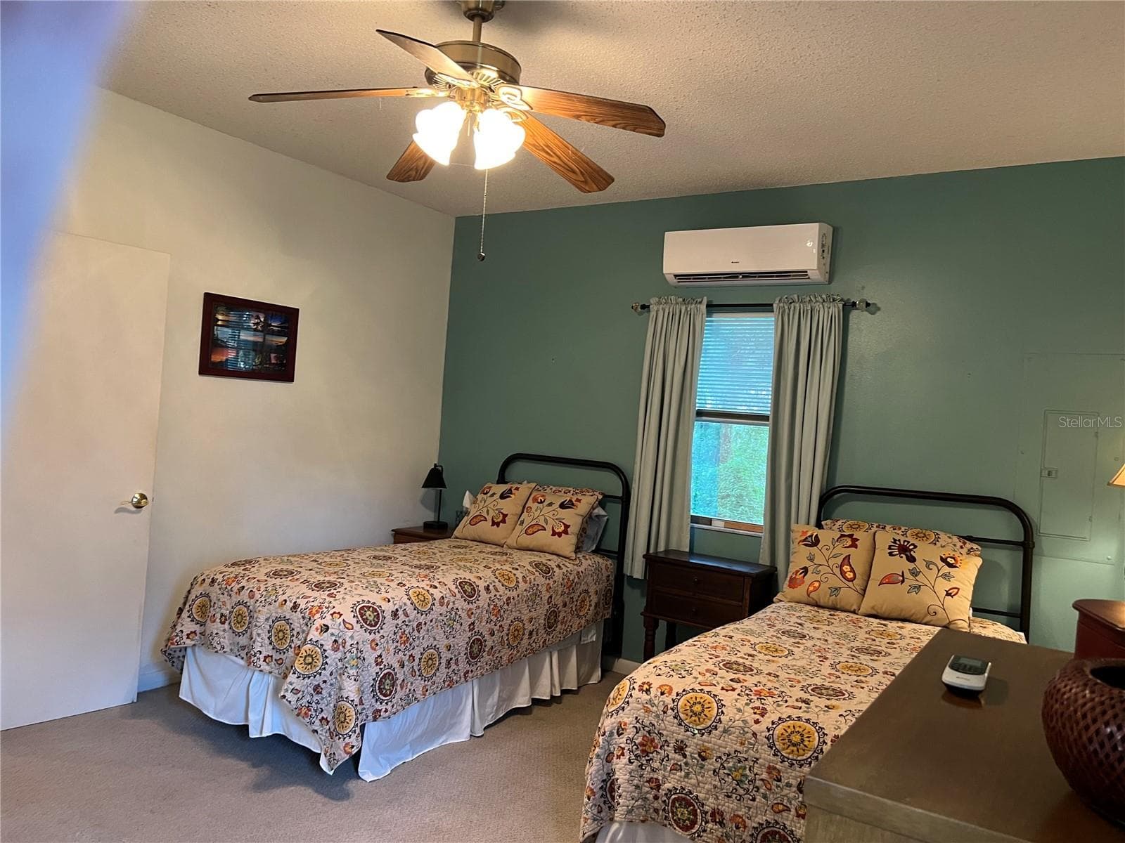 Guest House bedroom featuring twin beds - 267 N ORANGE AVE, LAKE HELEN