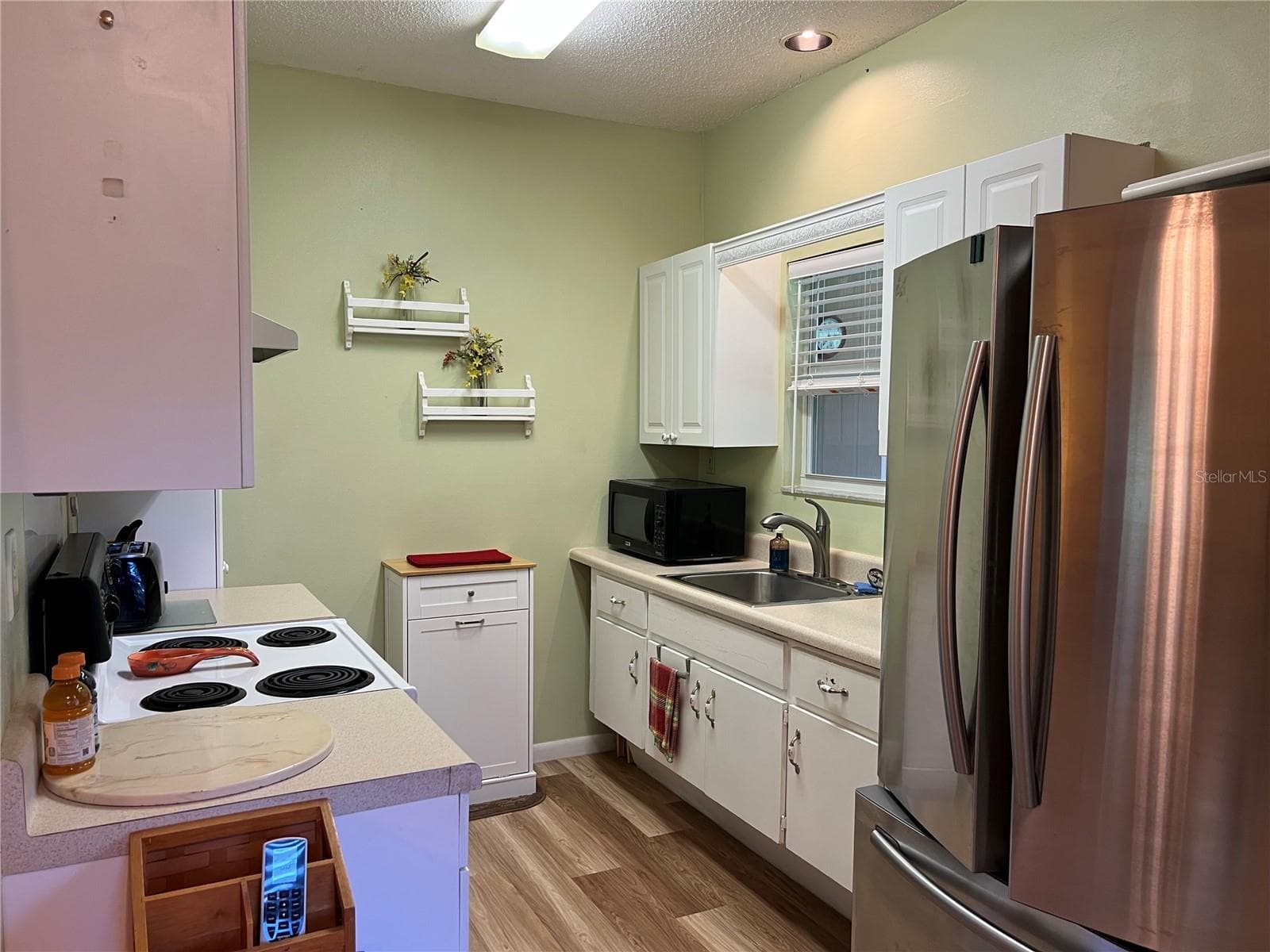 Guest House kitchen stainless fridge - 267 N ORANGE AVE, LAKE HELEN