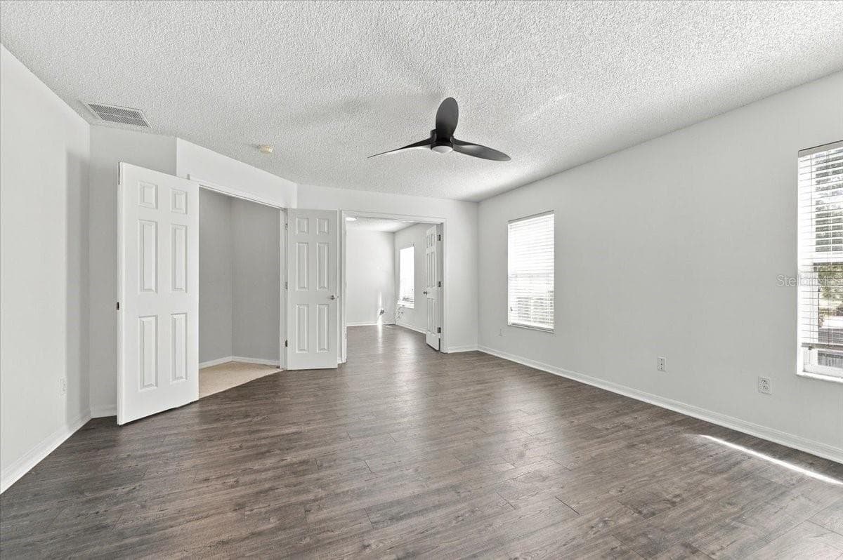 Primary Bedroom into sitting rom - 10003 AUTUMN CREEK LN, ORLANDO