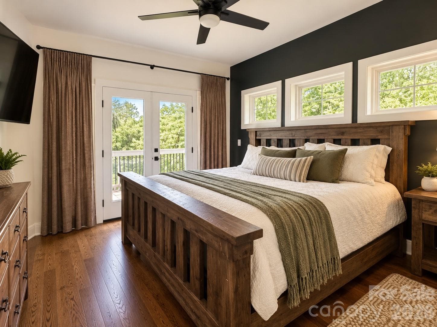 Main floor-Primary bedroom with french doors leading to the wrap around porch - 651 Cemetery Road, Nebo