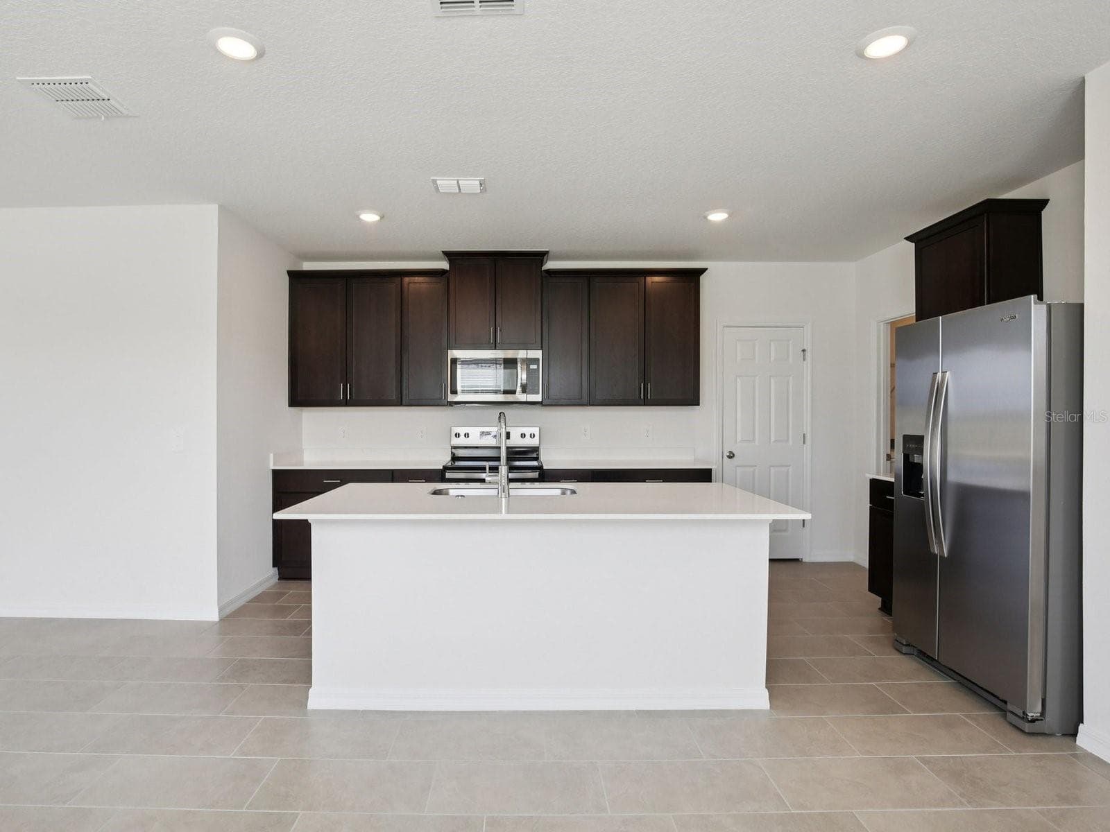 Photo is not of the actual home, but is an inspirational photo of builder’s model home and may depict options, furnishings, and/or decorator features that are not included - 3920 TEAK LN, BARTOW