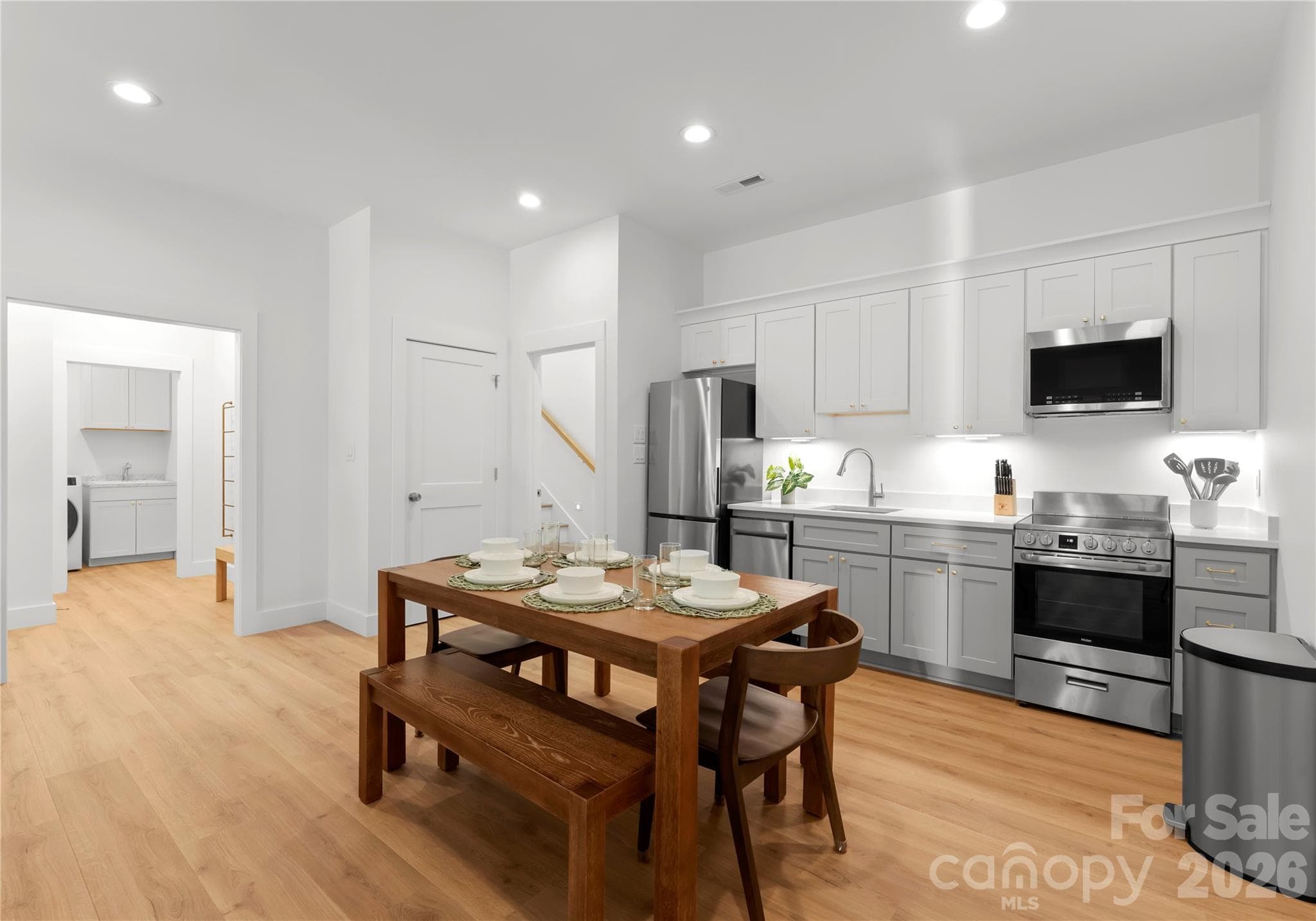 Downstairs, a second kitchen and dining area make the lower level especially convenient for hosting guests. - 143 Hideaway Lane, Mooresville