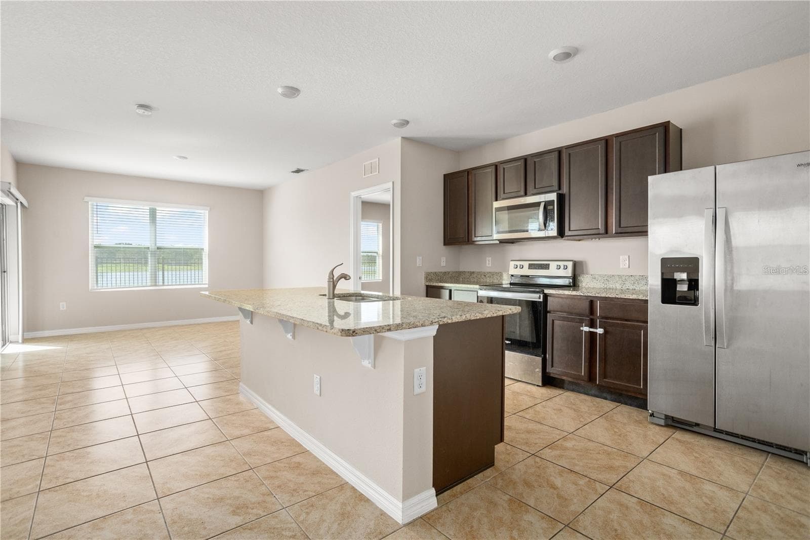 Kitchen with Dining room facing the lake - 1112 FOX PATH, DAVENPORT