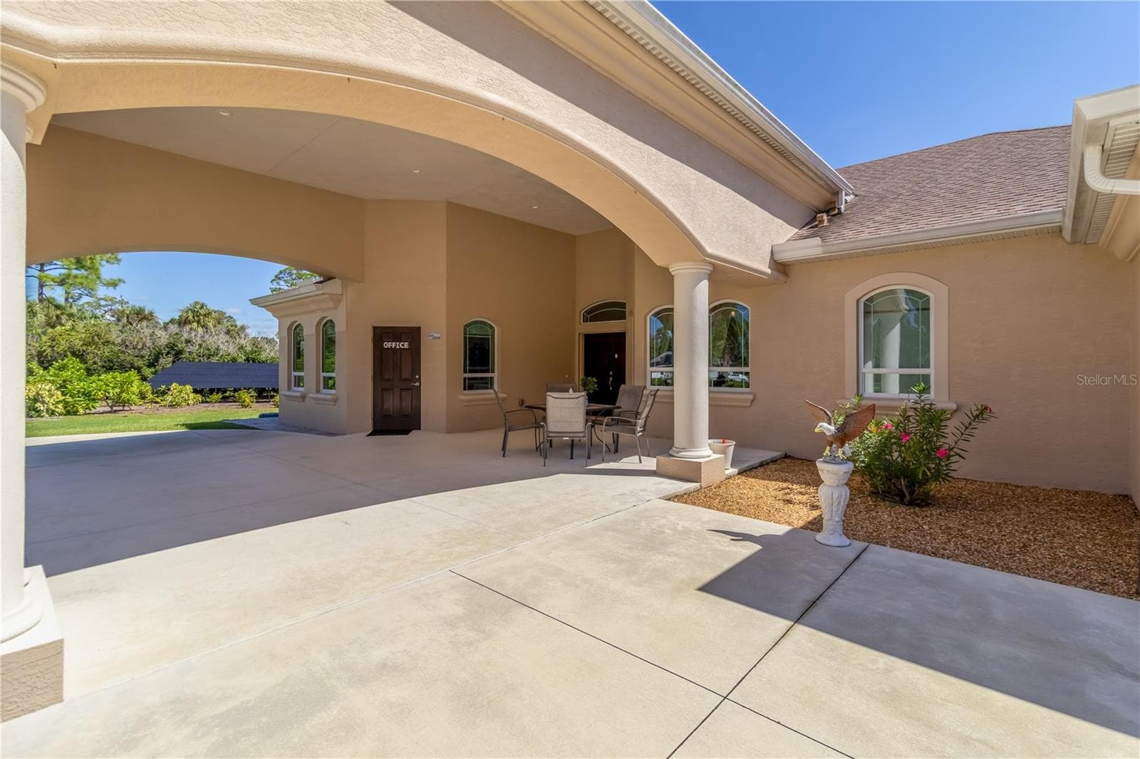 The parking arch not only protects you from the elements but adds a stately feel to the home. The door on the left leads to the dedicated office. The double doors to the right (with the transom window) leads to the main entrance of the home. - 1991 HEASLEY, ENGLEWOOD