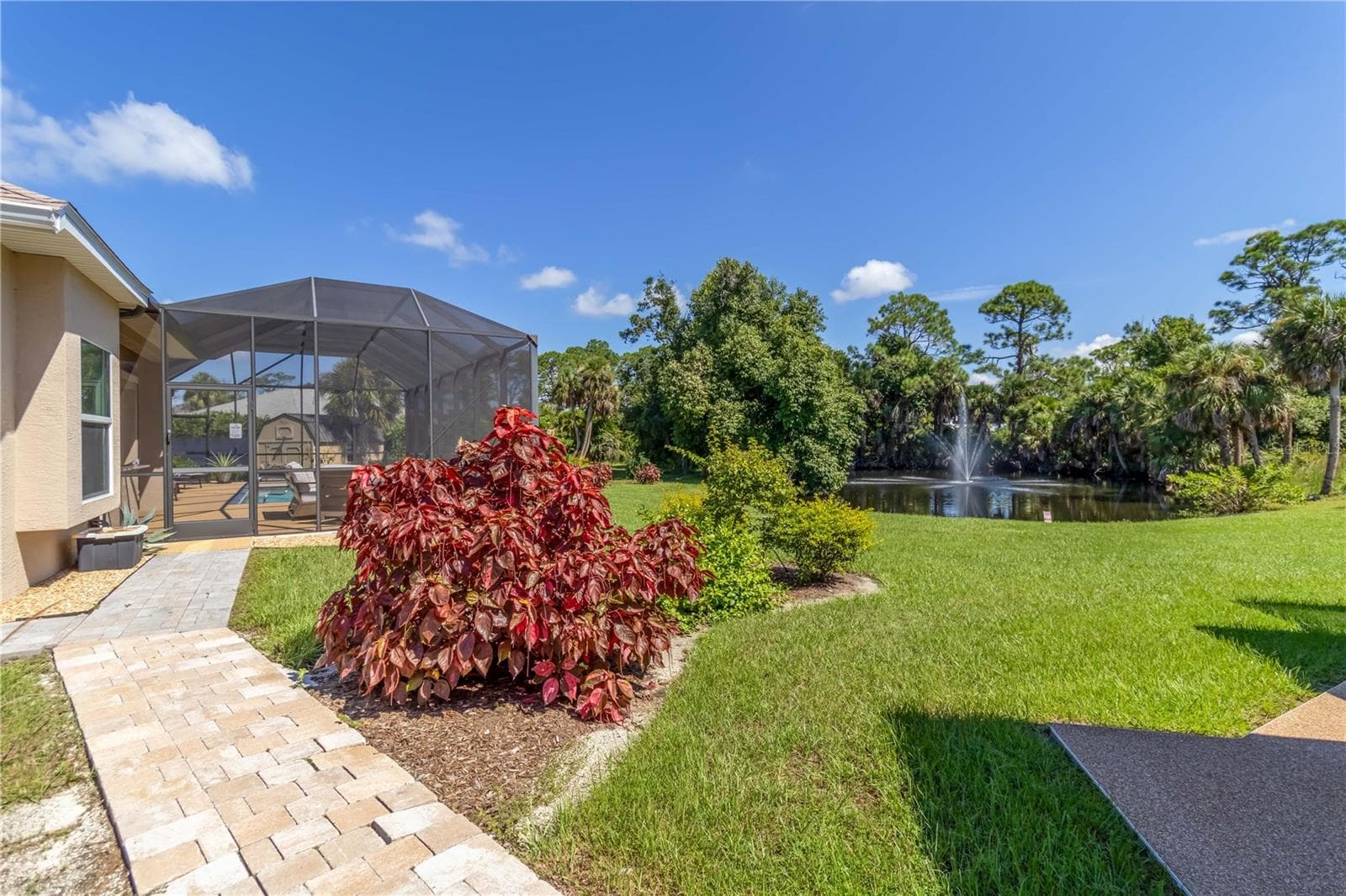 The lot has plenty of open space but plenty of mature tress too for privacy. I just love that fountain. The sellers have a picture of otters that were in their pond! - 1991 HEASLEY, ENGLEWOOD