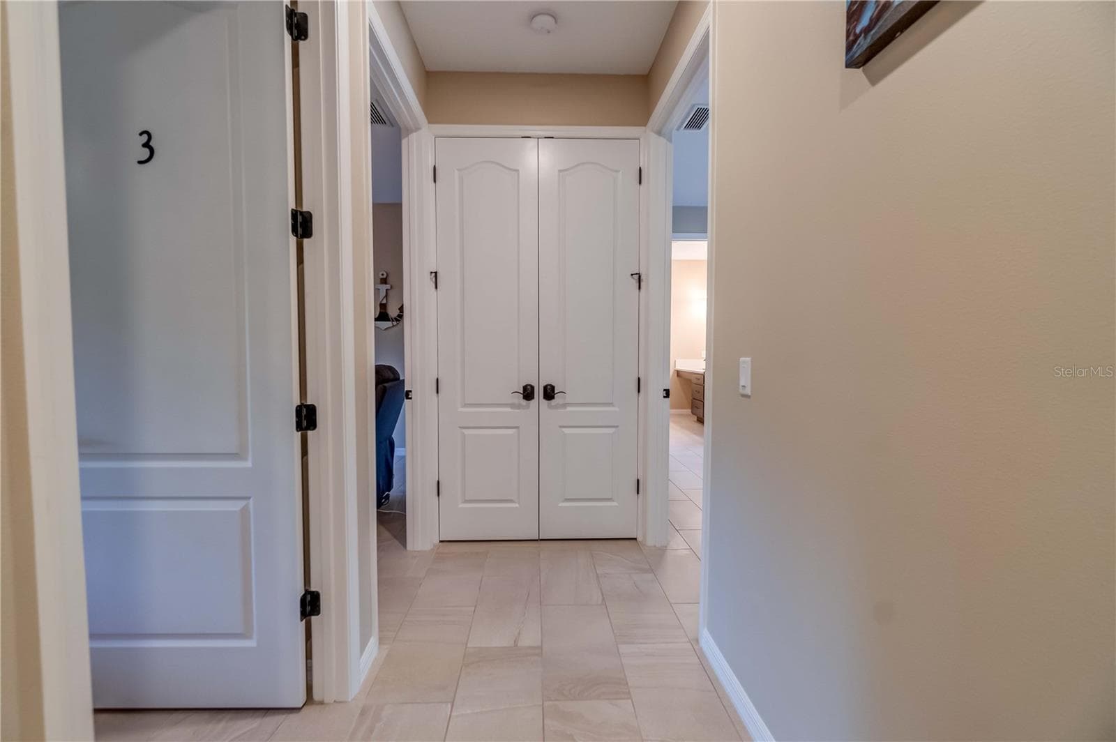 Another picture of the water heater closet. The three open doors lead to individual suites. They are numbered  for the convenience of the guests. - 1991 HEASLEY, ENGLEWOOD