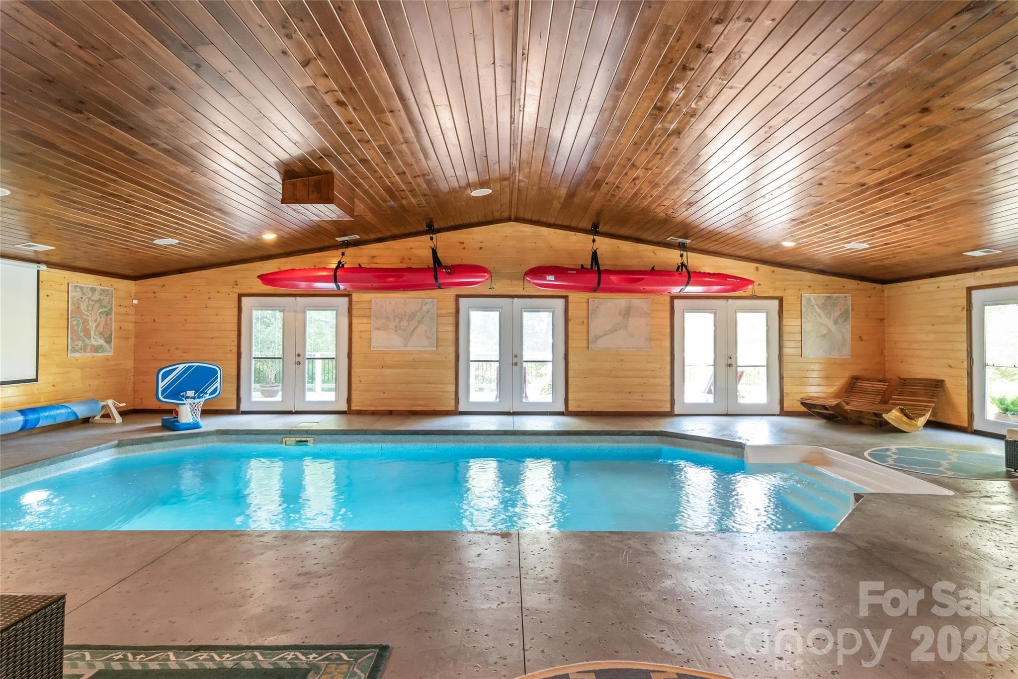 Your saltwater pool is surrounded by a heated and cooled entertaining space and can be enjoyed year round - 13934 Kings Carriage Lane, Charlotte