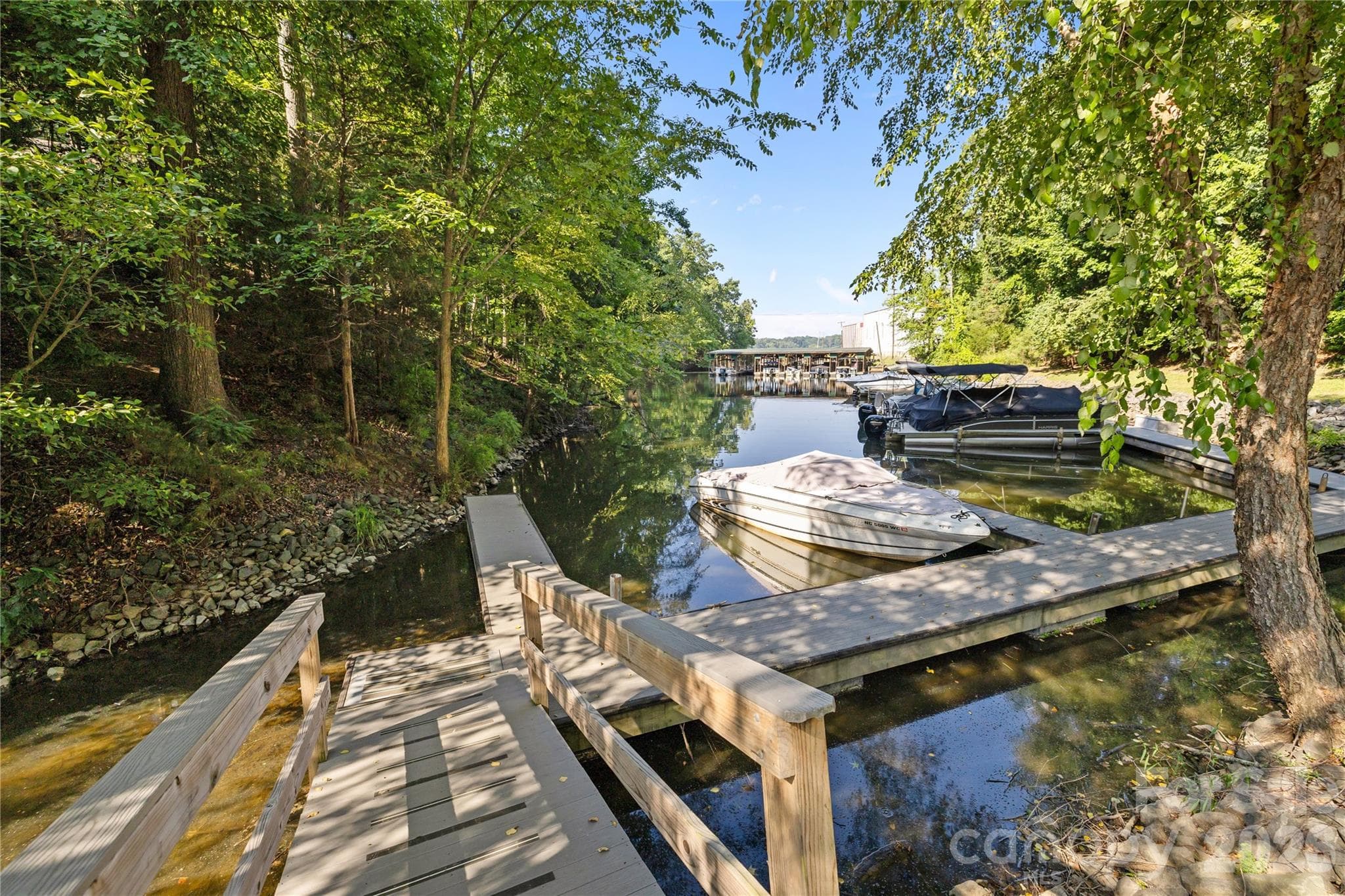 Deeded boat slip provides access to all Lake Wylie has to offer. This photo from last year shows the normal water level before this yrs extreme drought - 13934 Kings Carriage Lane, Charlotte