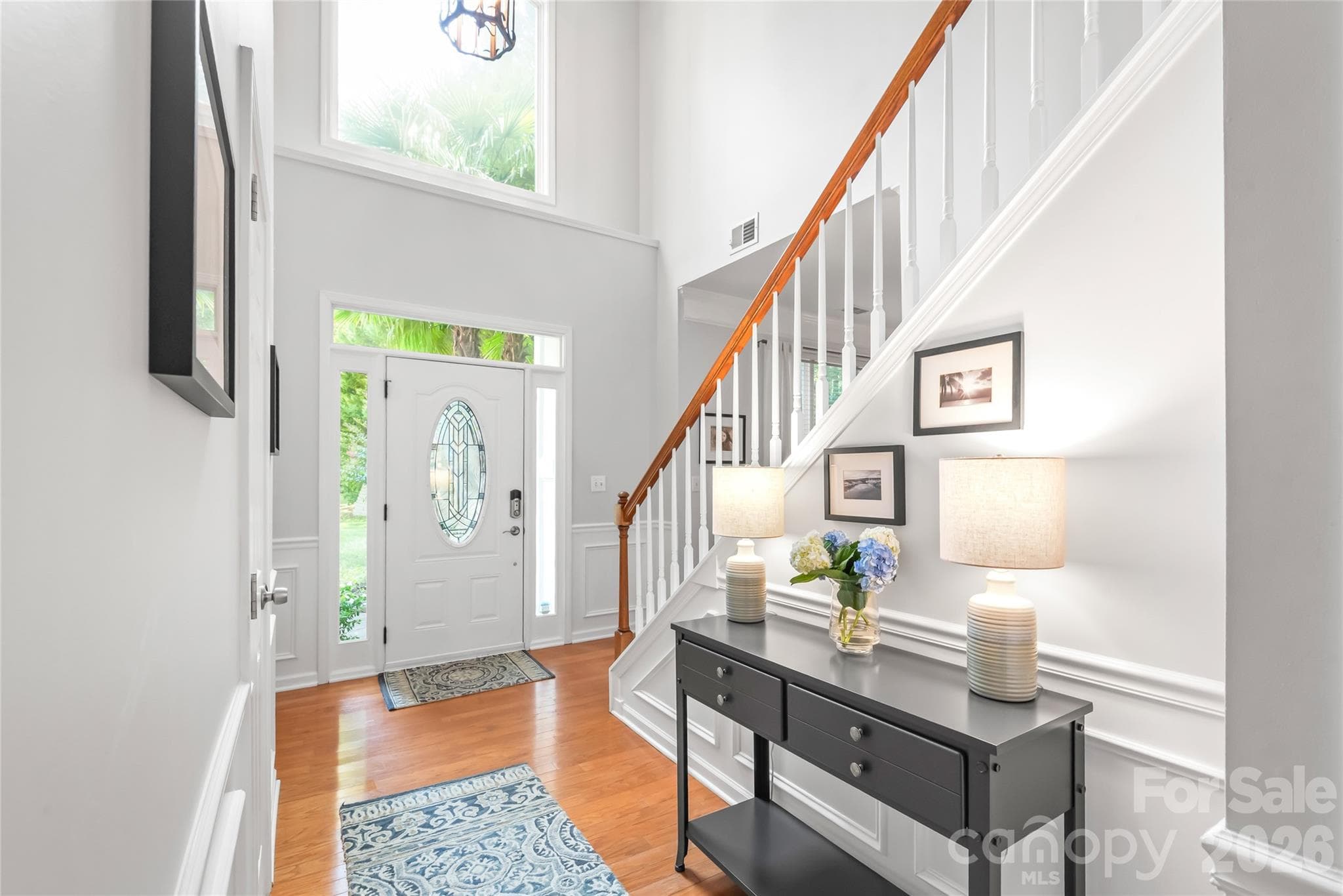 Bright and welcoming 2-story foyer greets you when you enter - 13934 Kings Carriage Lane, Charlotte