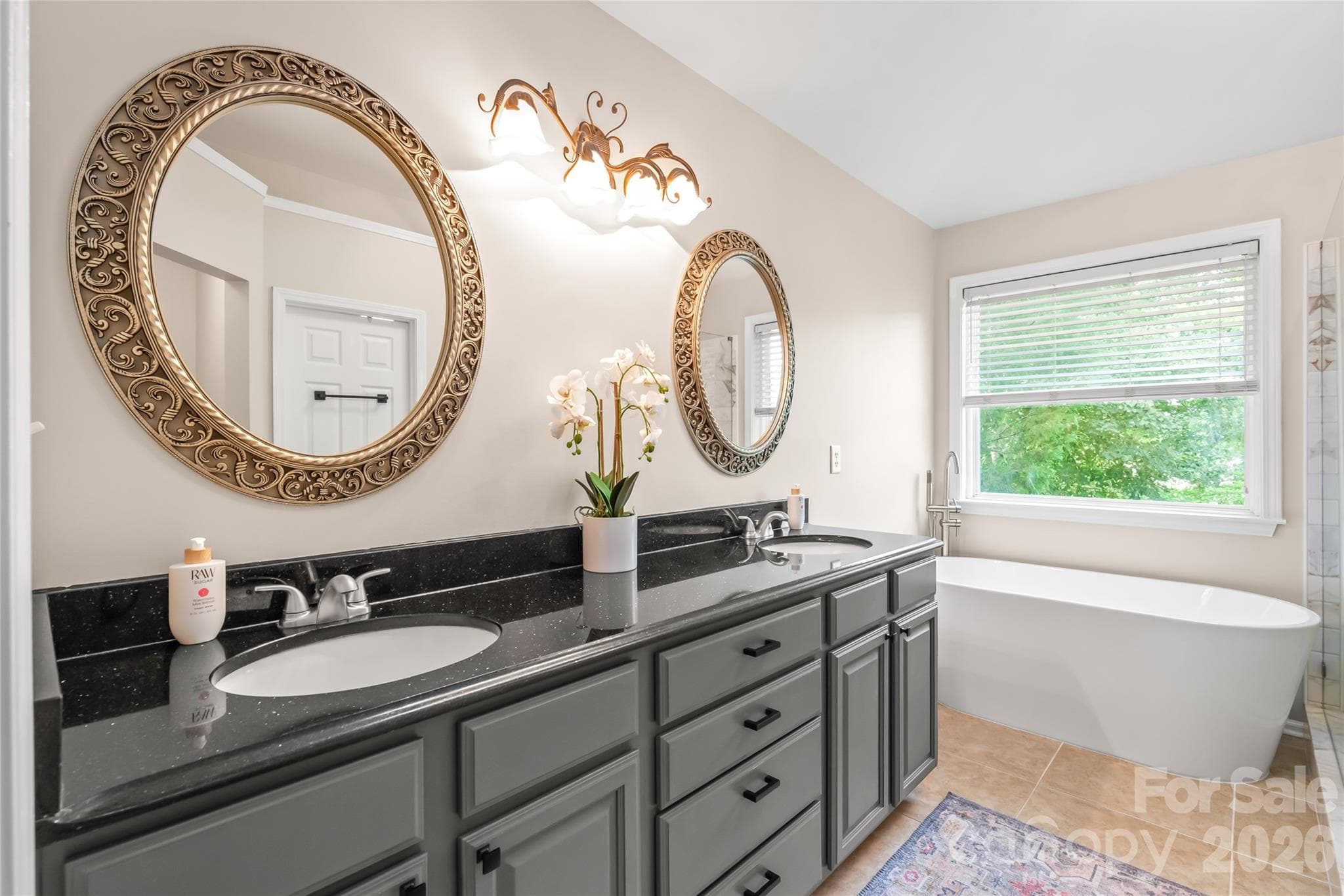 Updated primary bath with a soaking tub to relax away the stress of the day - 13934 Kings Carriage Lane, Charlotte