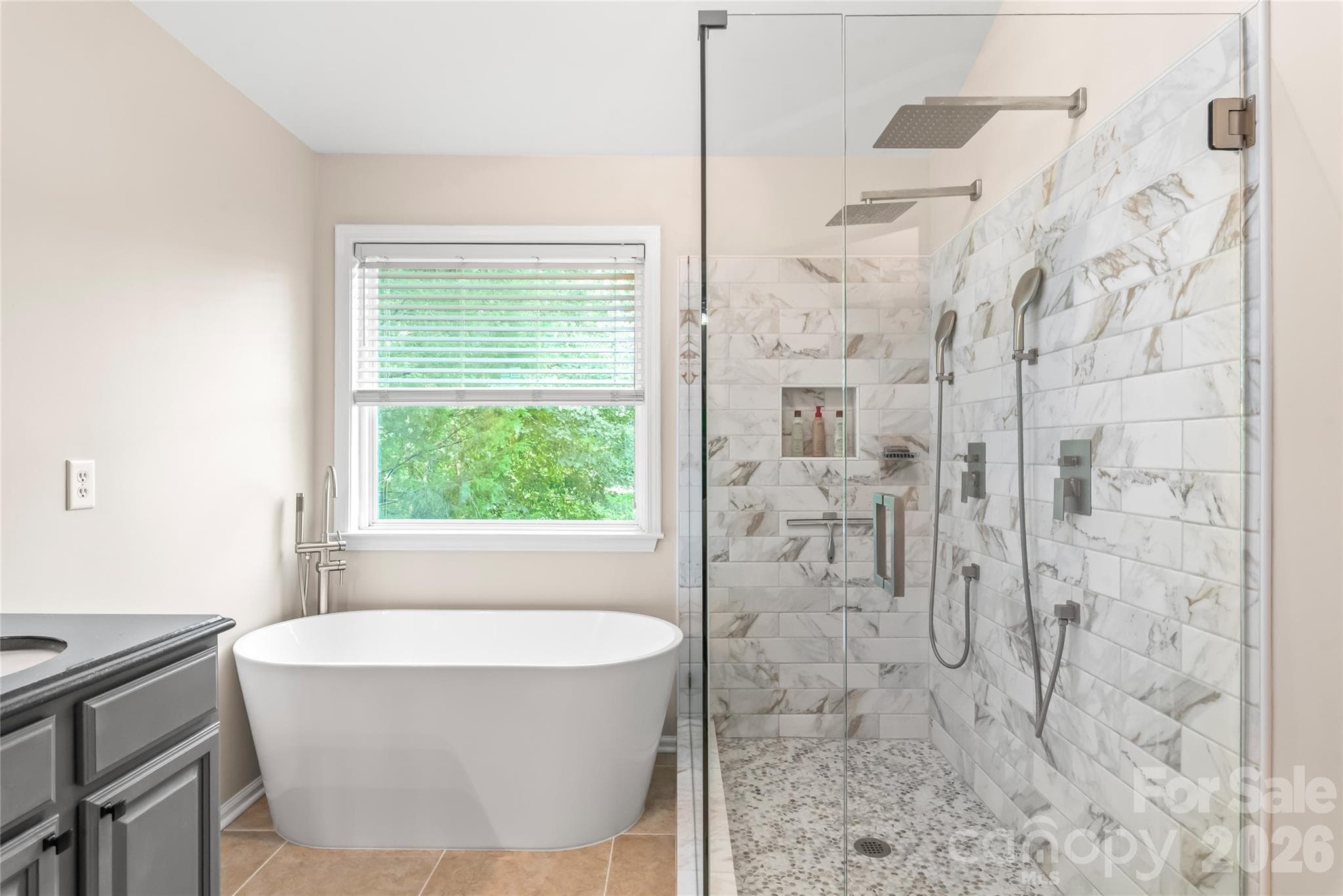 Oversized shower with two rainfall heads with beautiful tile surround - 13934 Kings Carriage Lane, Charlotte