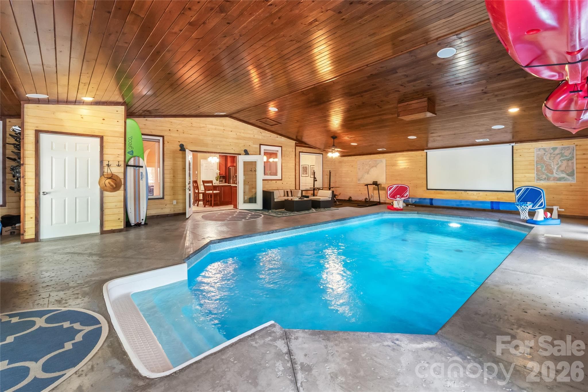 10,000-gallon saltwater pool is complemented by humidity-controlled, heated and cooled waterproof area for year round enjoyment - 13934 Kings Carriage Lane, Charlotte