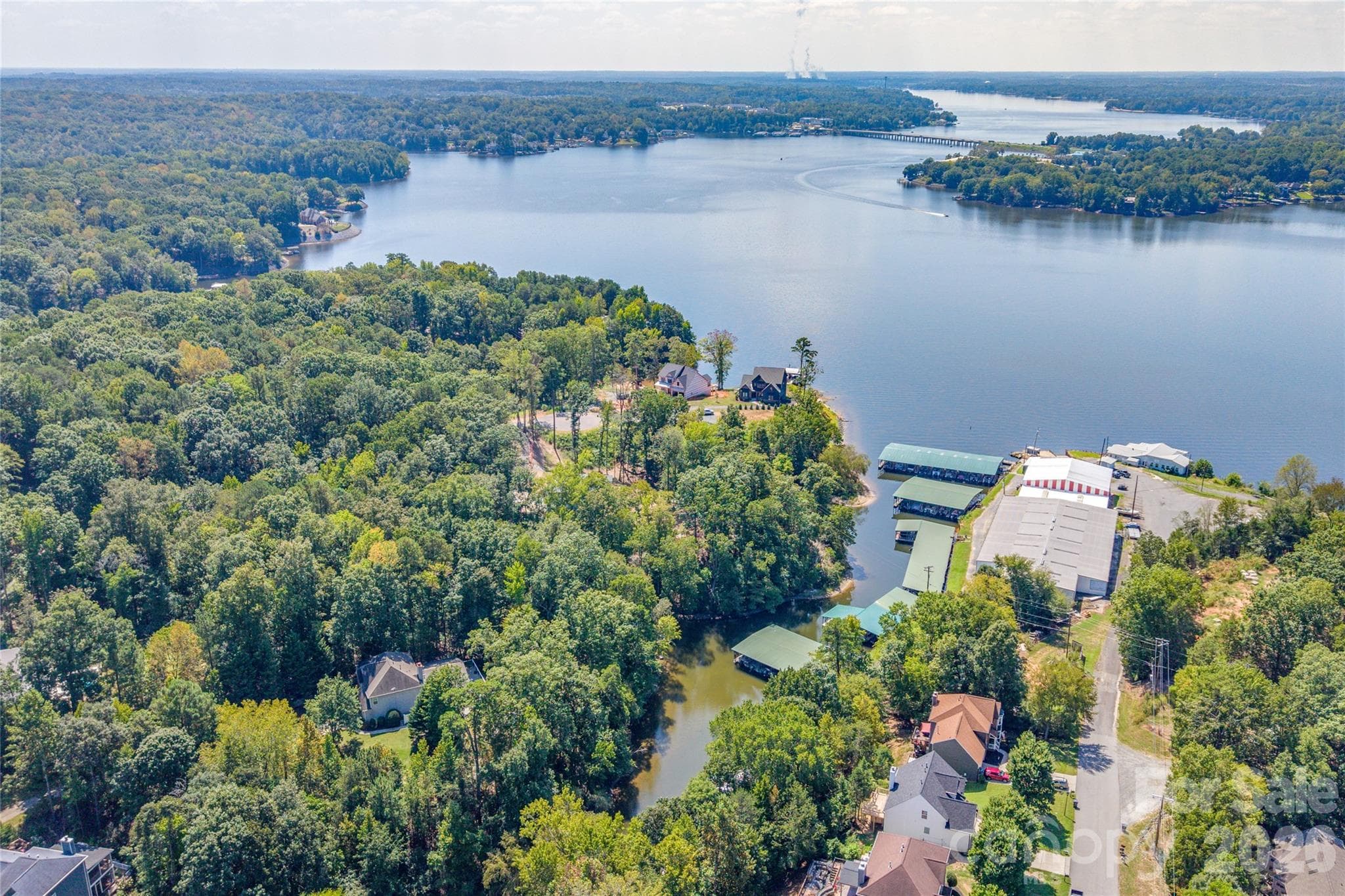 Ariel view showing the home, cove, and Terry's Marina. The view shows how close the HWY 49 bridge is and easy access to Papa Doc's by water! - 13934 Kings Carriage Lane, Charlotte