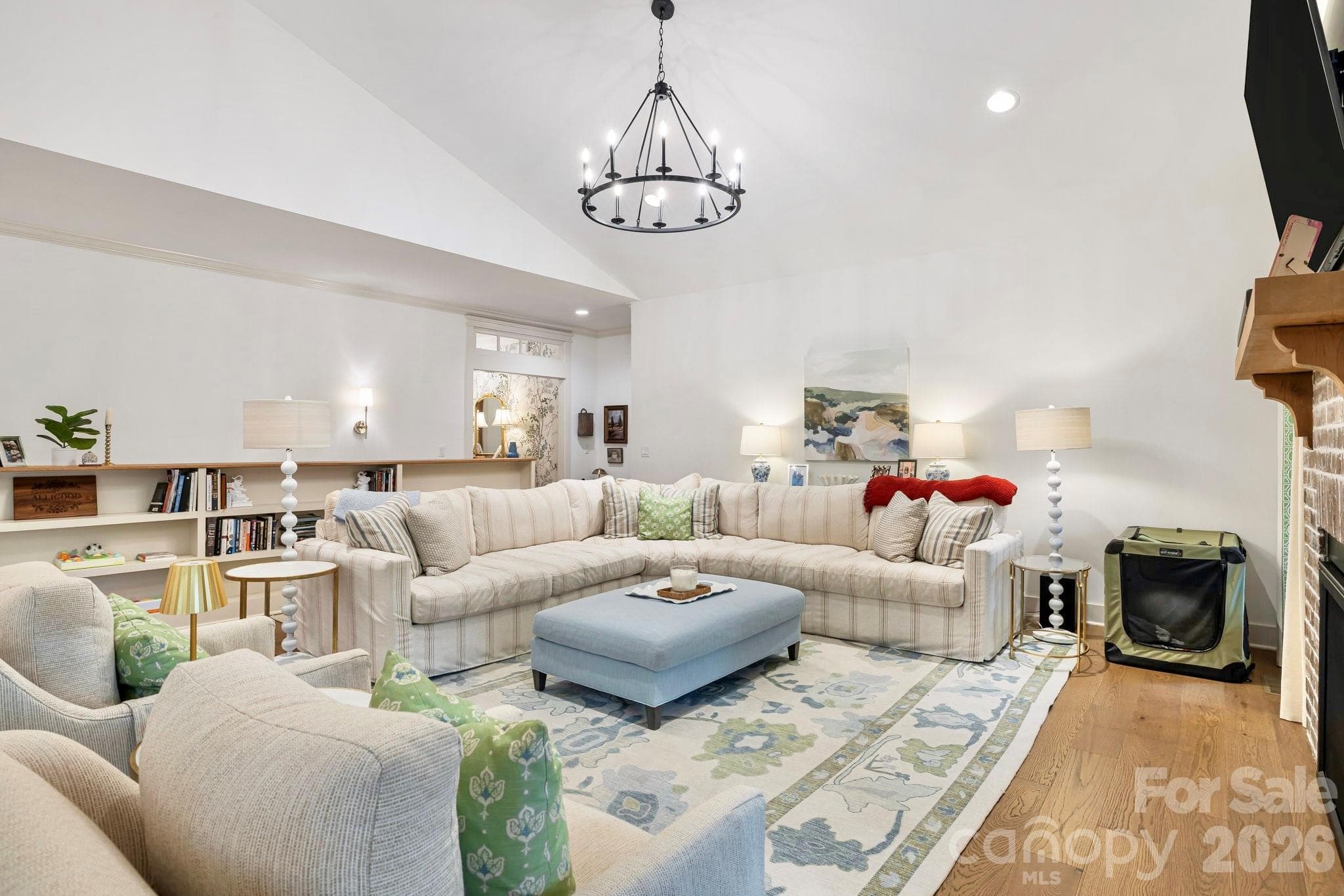 Living room with custom built-in bookshelves. - 14 Sugarland Ridge Trail, Fairview