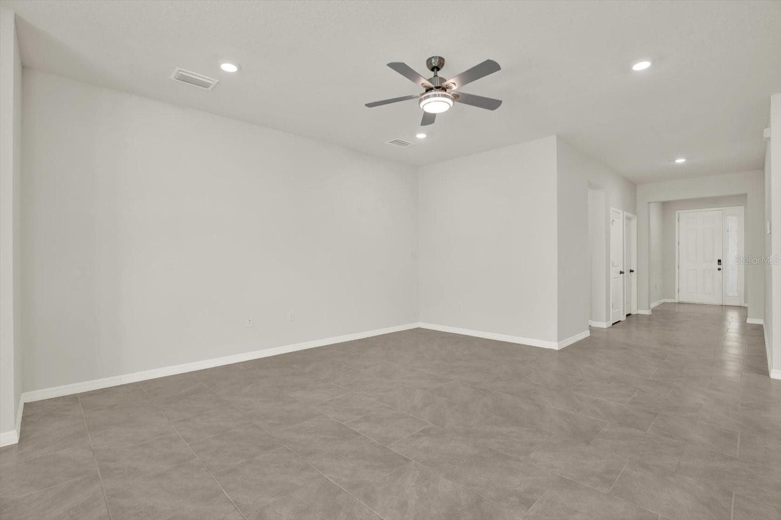 Living Room looking back to the front door. - 10966 DELTA HUFF CT, SAN ANTONIO