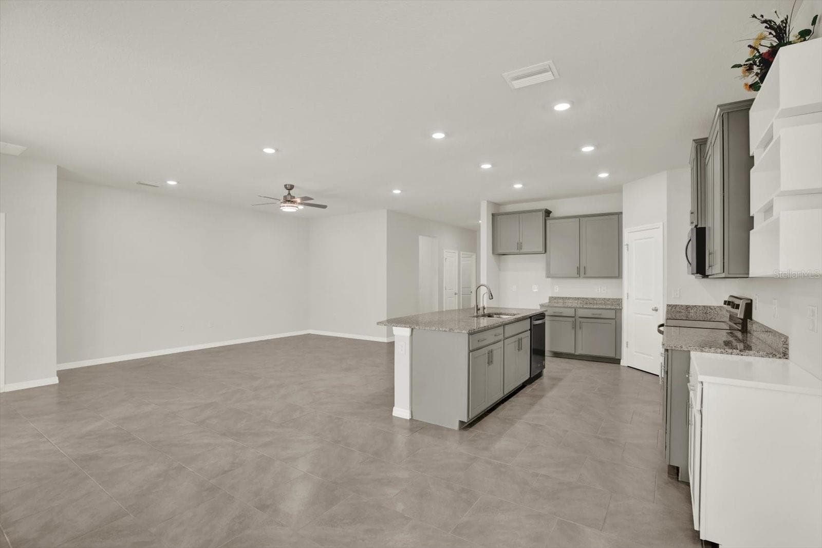 View of kitchen and Living Room from Dining Area - 10966 DELTA HUFF CT, SAN ANTONIO